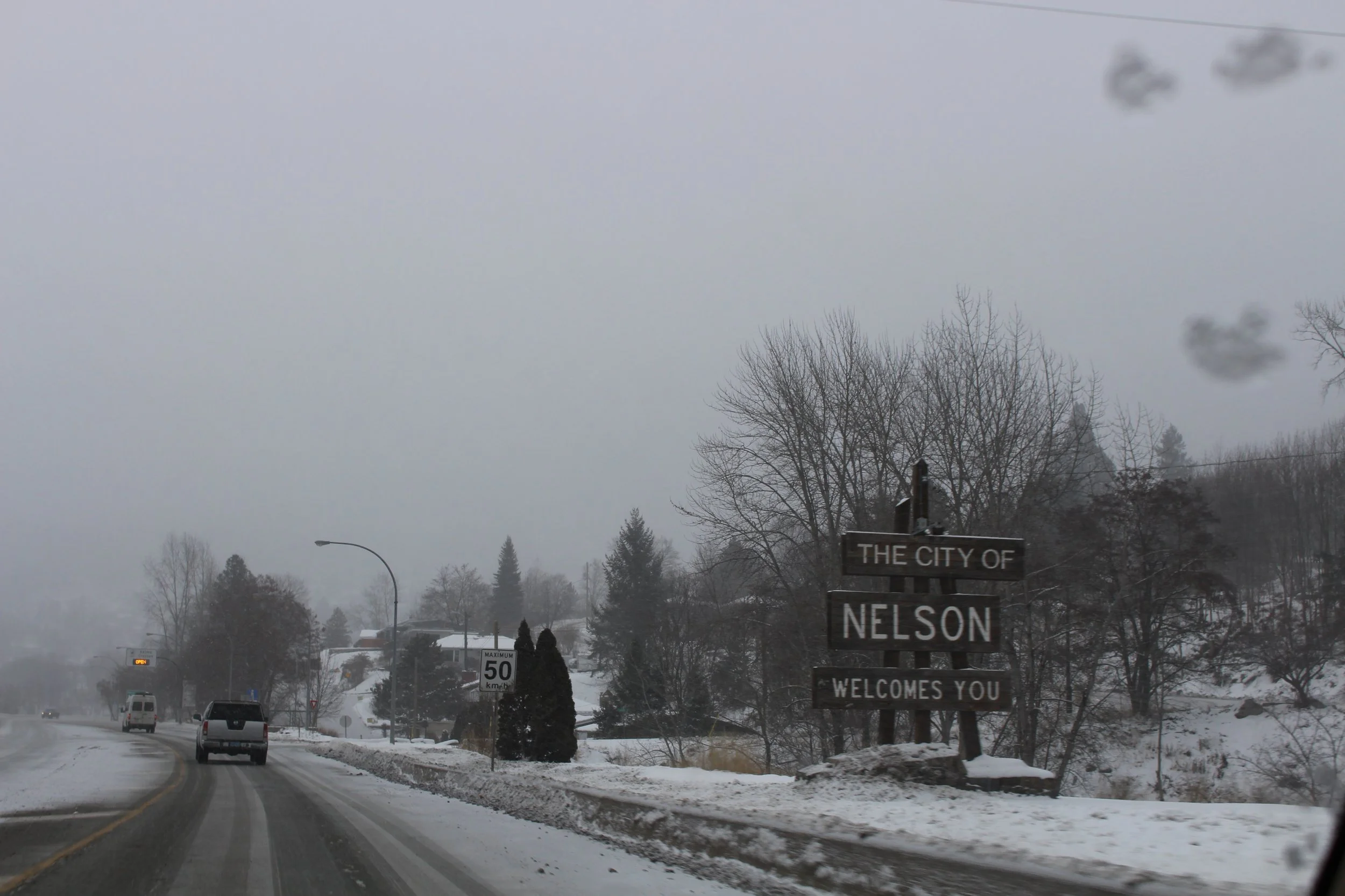 Welcome sign driving into a snowy Nelson, British Colombia Dec 2017