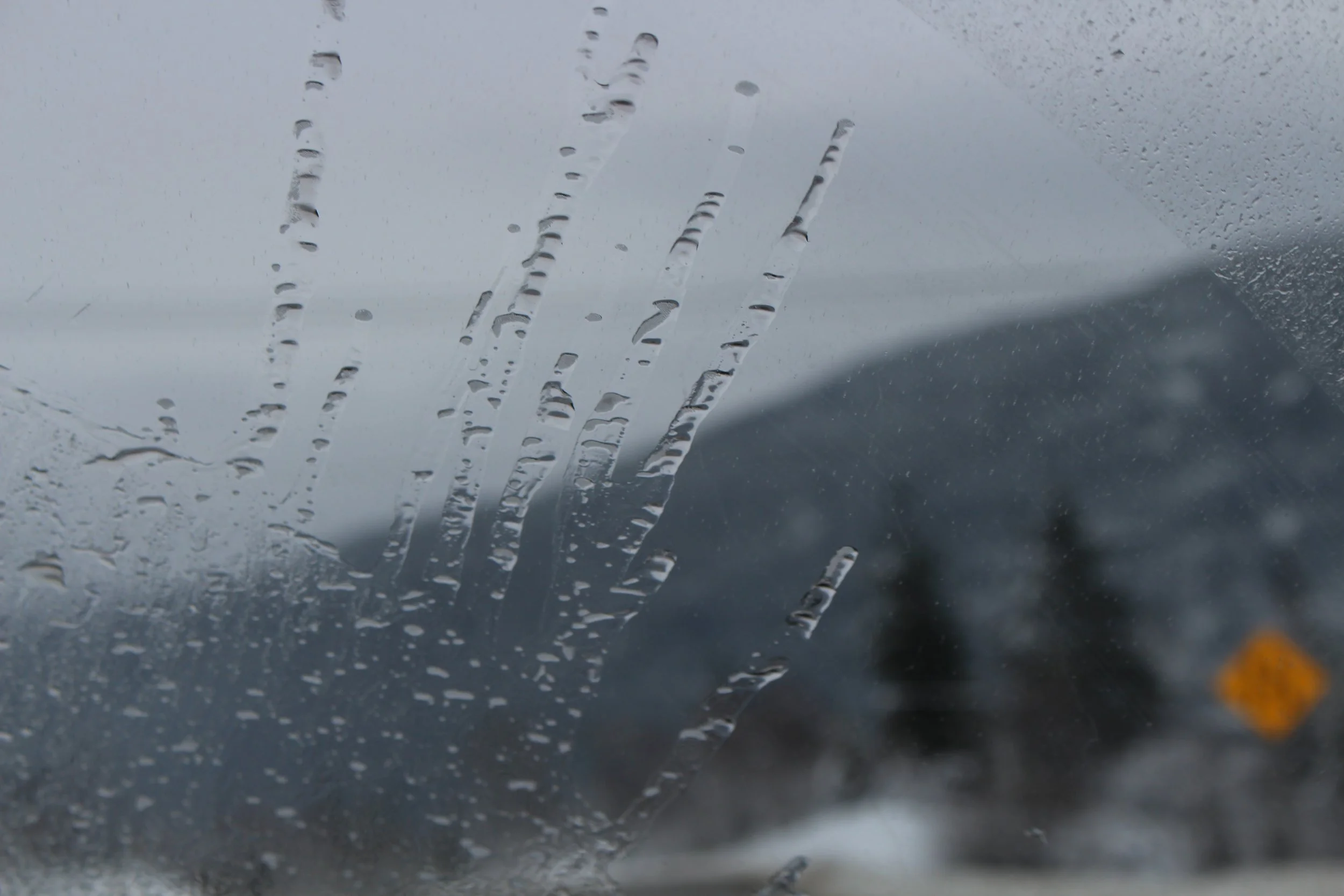Water gliding up the windscreen of the car driving to Nelson, British Colombia Dec 2017