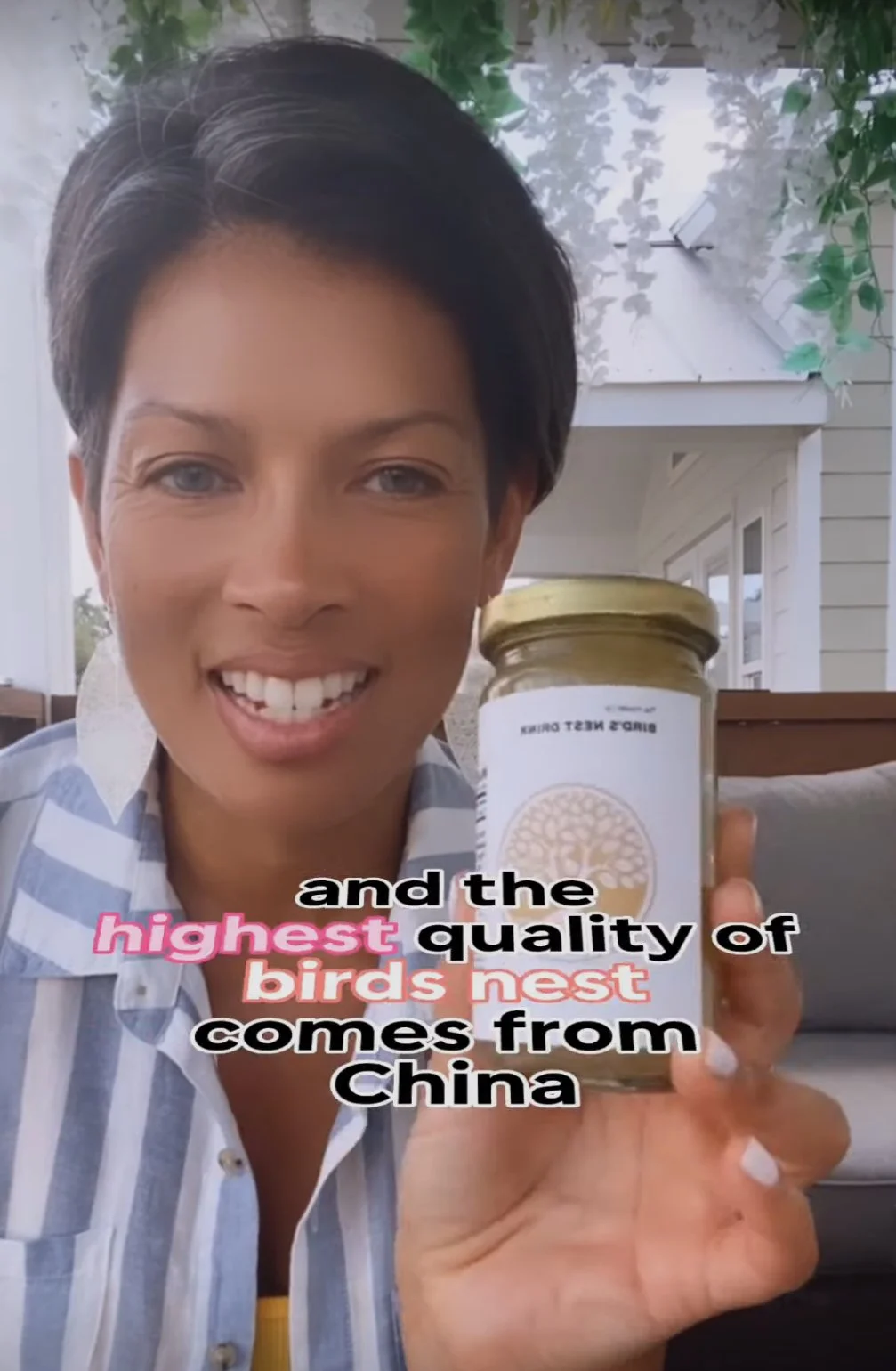 Woman with short dark hair smiling and holding a jar labeled 'bird's nest drink,' with text overlay saying 'and the highest quality of birds nest comes from China'.