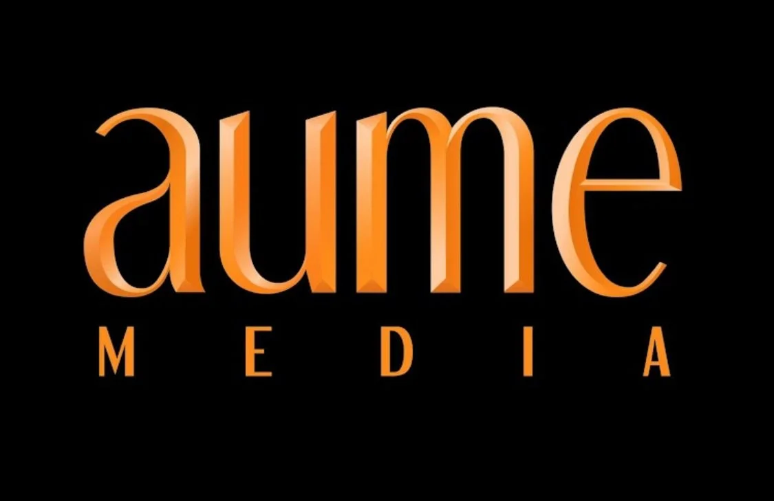 A logo with the word "aume" in large orange 3D letters above the word "MEDIA" in smaller orange letters, set against a black background.