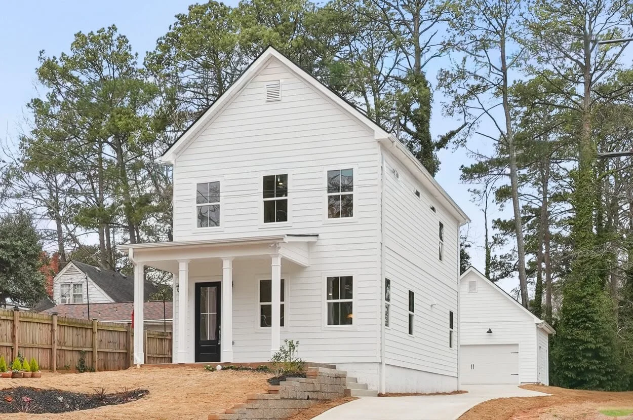 Perched high above the street, this striking new construction blends timeless architecture with modern Atlanta living. Downtown skyline views, a rare detached 2-car garage, and just a 5-minute walk to the Beltline make this home as effortless as it i