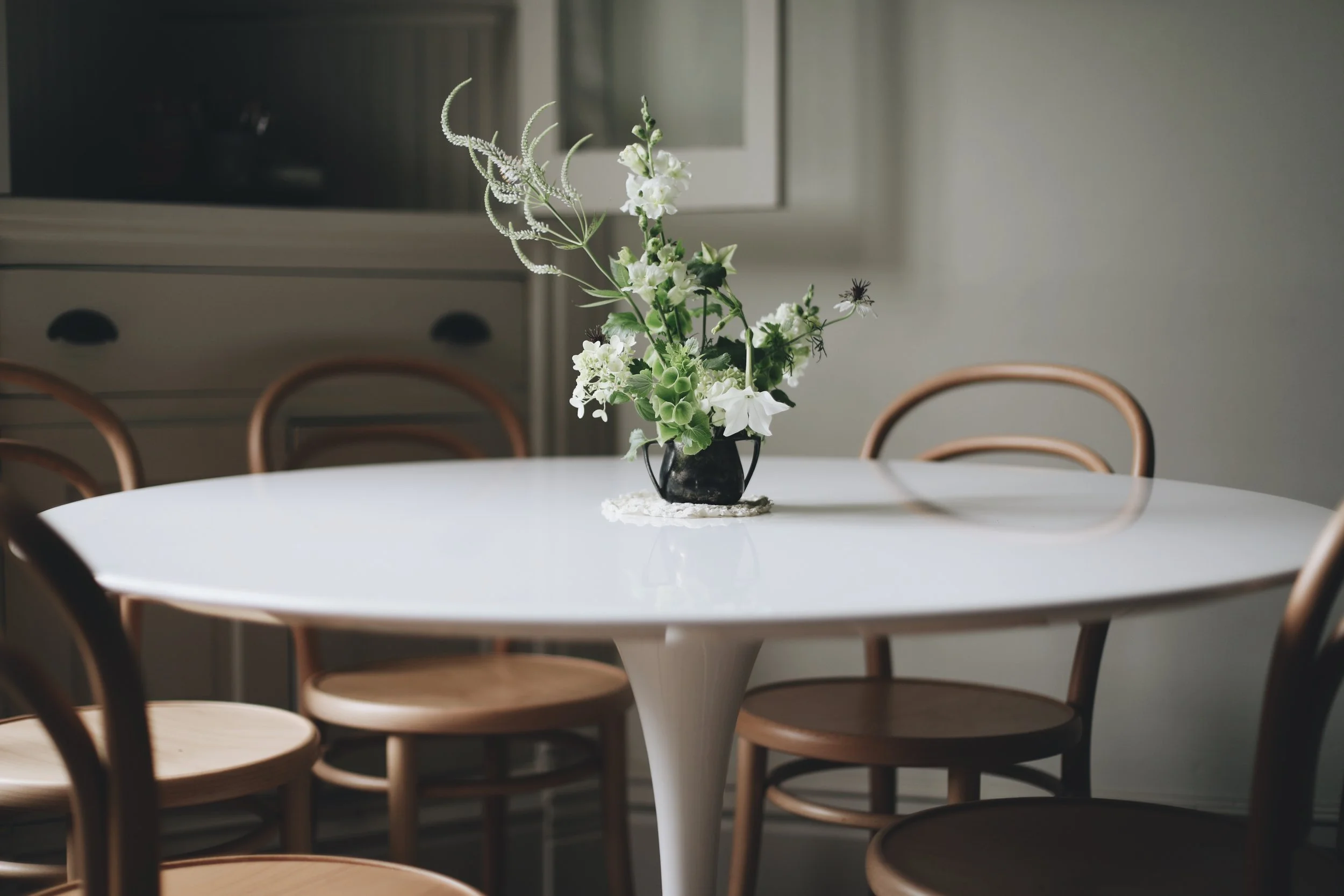 green + white in a pewter cup