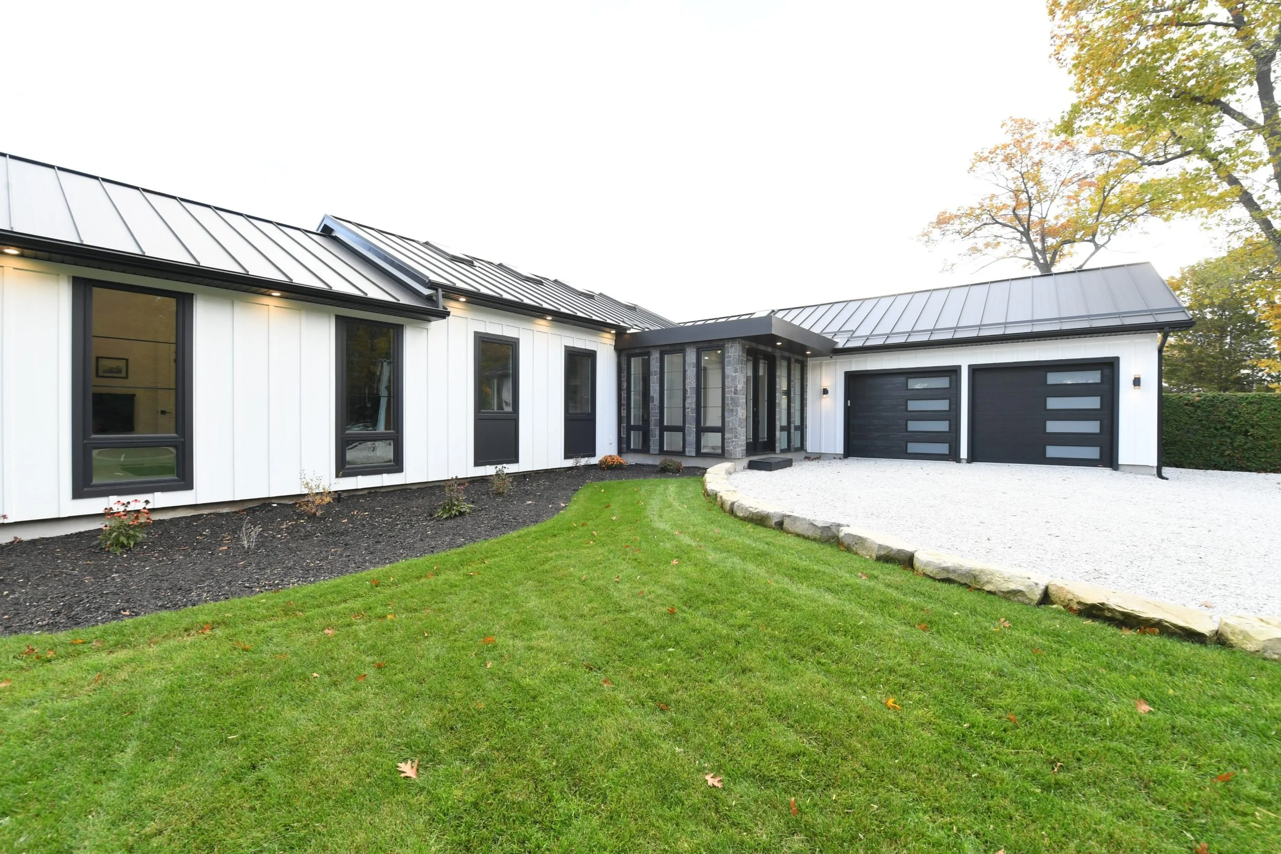 white board and batten exterior black roof.jpg