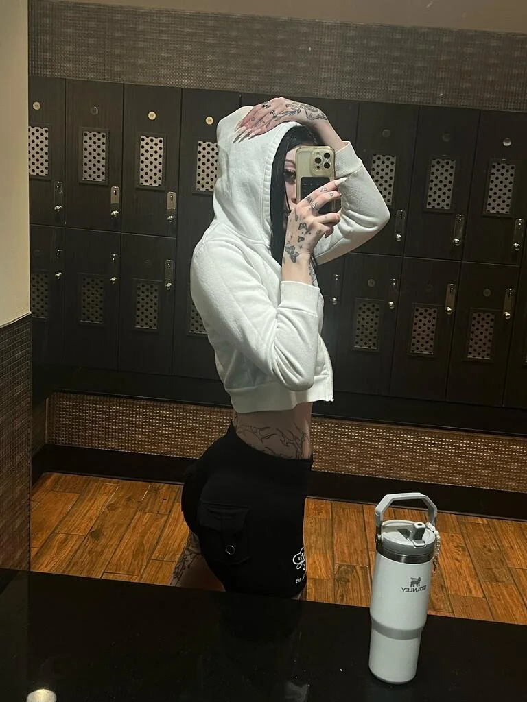 Woman wearing Black F3 Elite Black button pocket scrunch booty shorts.jpeg