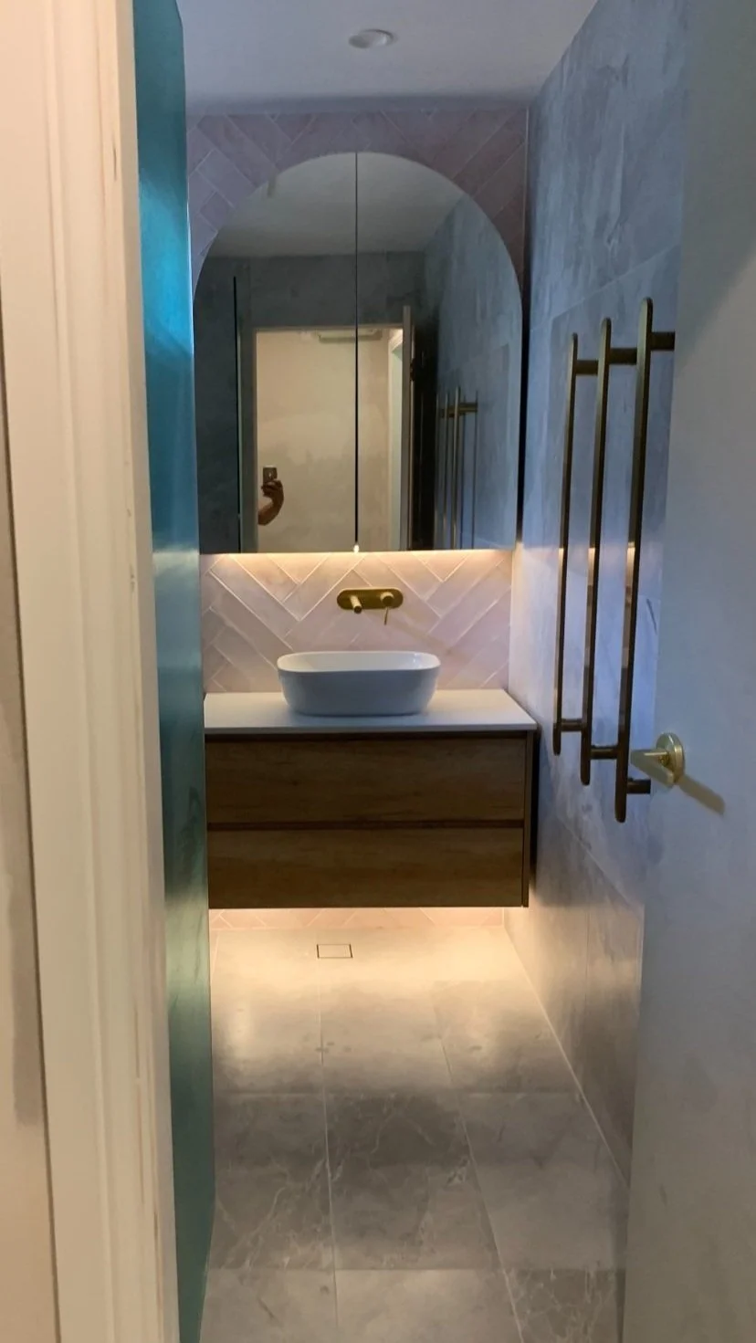 after modern bathroom renovation with vanity underlights