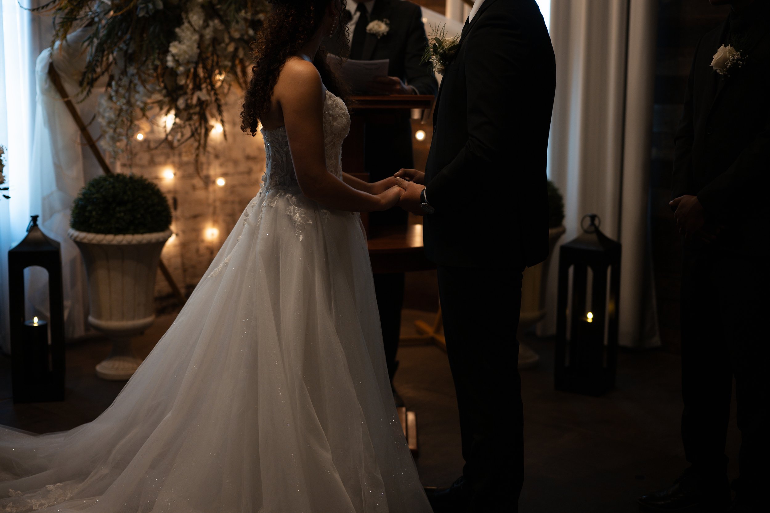 Dark and moody lighting at a Cajun Cafe wedding in Lake Charles, Louisiana.