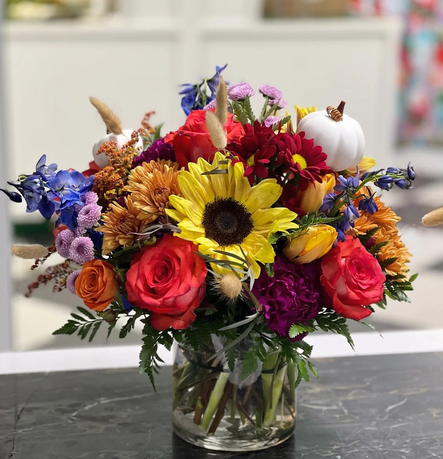 🍂 Weekend vibes are here, and so are the flowers 🌻✨ This bright fall arrangement is giving all the cozy, colorful feels with sunflowers, mums, roses + the sweetest little pumpkin. 

We&rsquo;re open today 10&ndash;2 &mdash; stop by and grab a burst