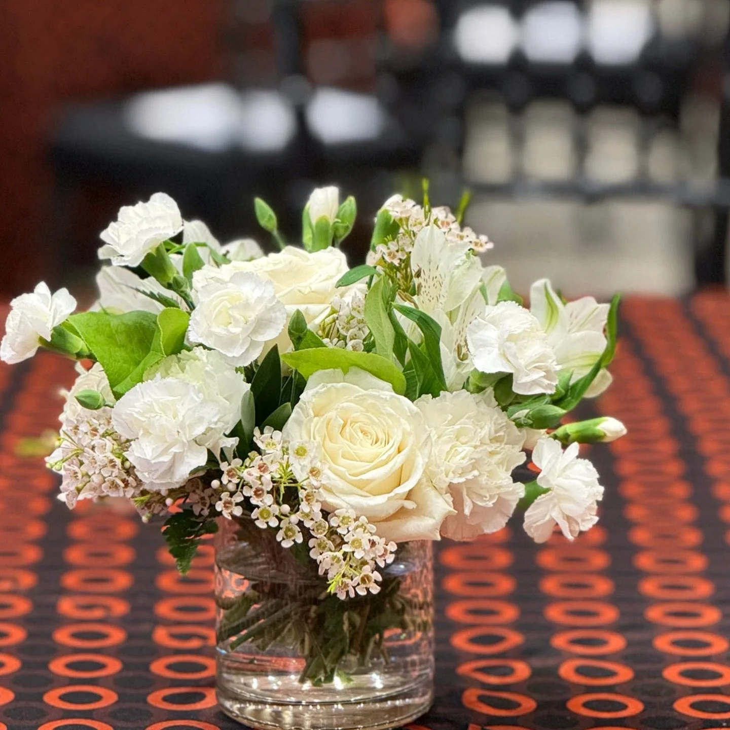 Event season is in full swing on campus 🏫🧡🖤 When the linens go orange and black, our blooms go white &mdash; perfectly Cowboy, perfectly classic 🤍