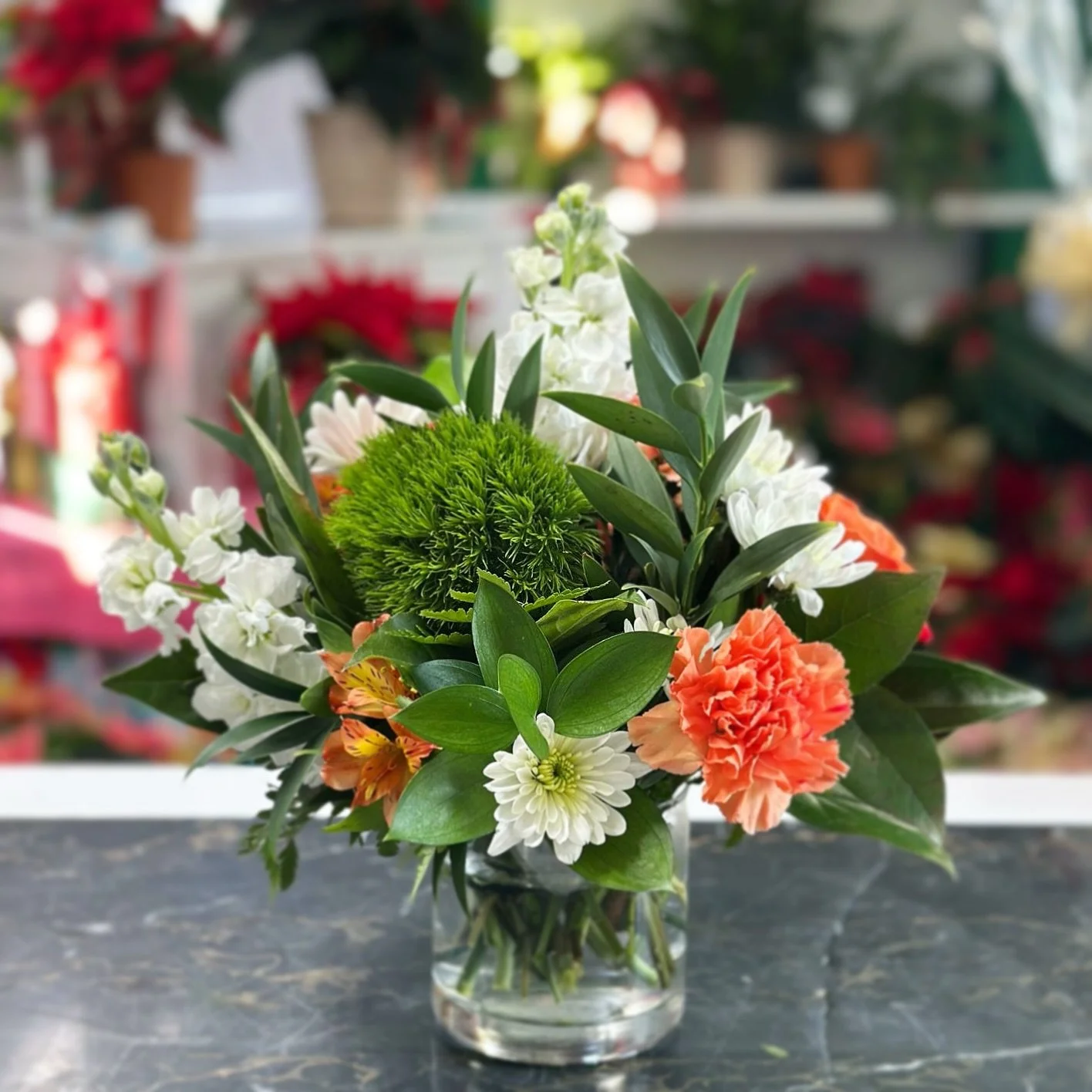It may be the season of red and green &hellip; but it&rsquo;s also Orange Friday, and we&rsquo;re not skipping a beat. 🧡🎄✨
Here&rsquo;s to our Cowboys wrapping up the semester and heading into finals with confidence (and maybe a few blooms for luck
