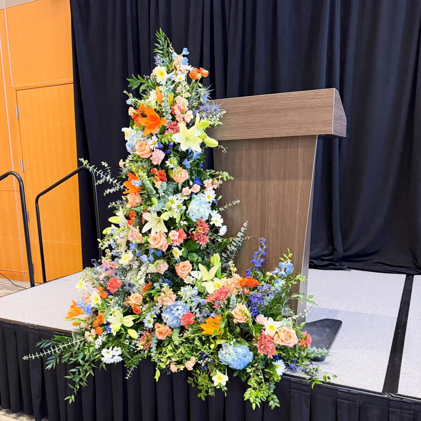 Honoring a beautiful life with blooms that feel just as vibrant, layered, and full.

A celebration of life, told through color, movement, and every thoughtfully placed stem. 🧡💙🤍