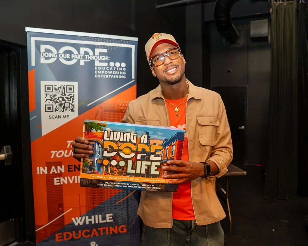 Sir Will holding the Living a DOPE Life game box