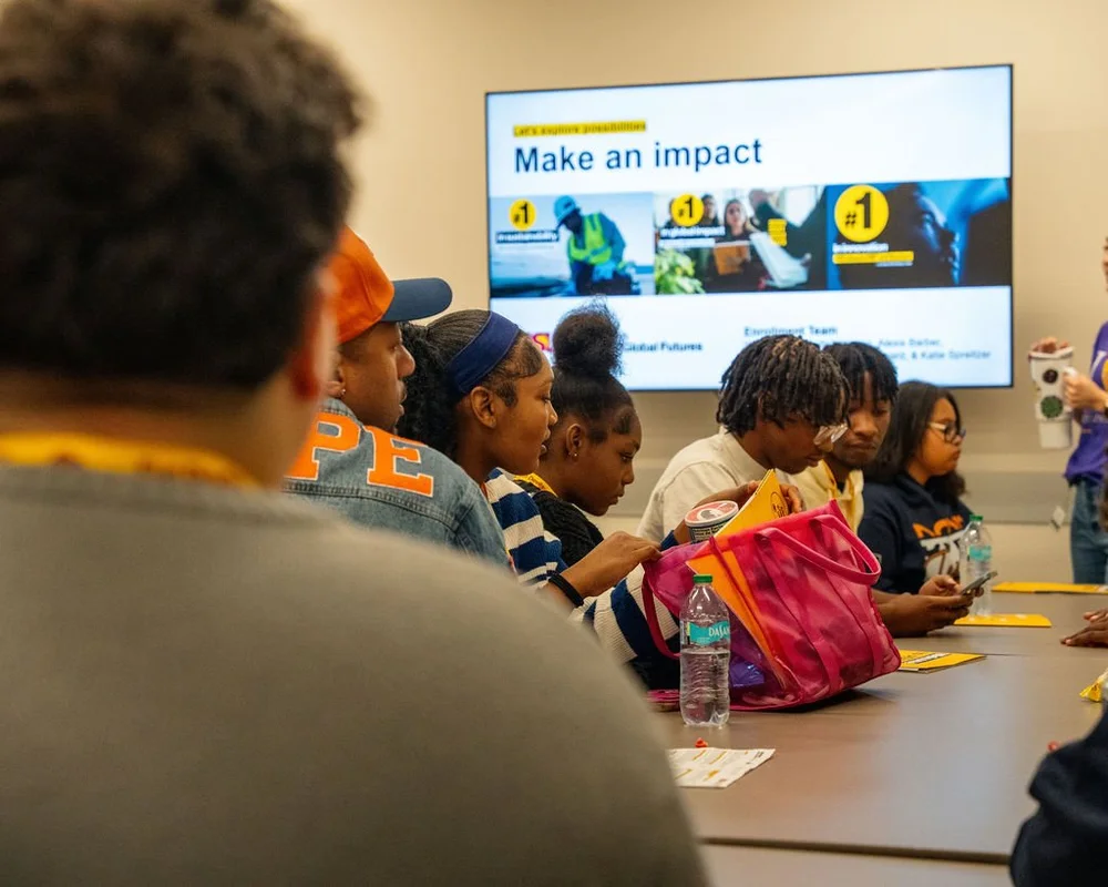 Teens learning about college opportunities during a campus visit