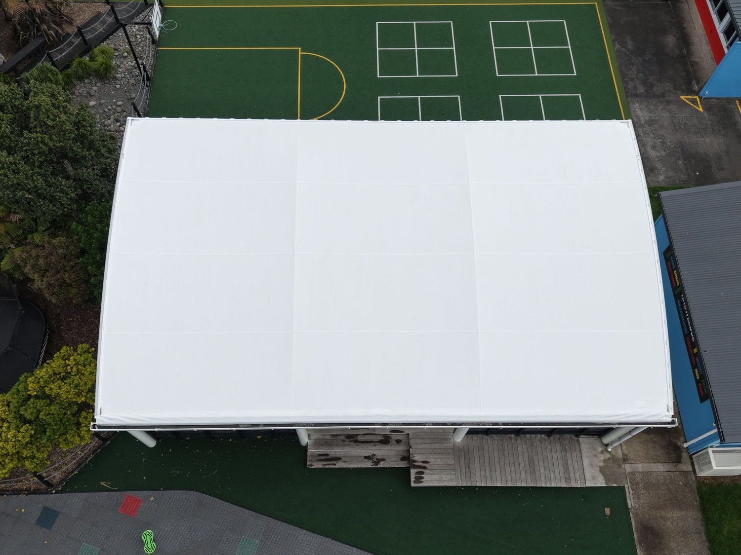 Bright white school COLA canopy from above