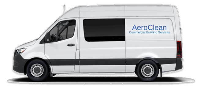 White commercial van with AeroClean logo on side for building cleaning services