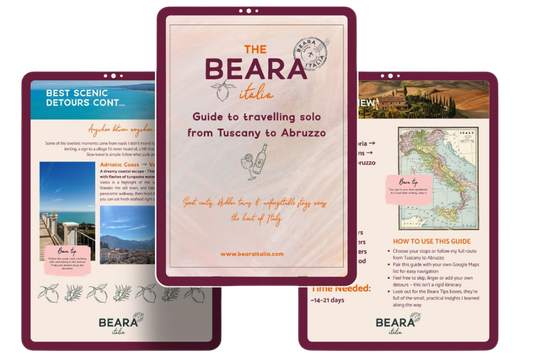 Digital travel guide mockup by Beara Italia showing pages of ‘The Beara Italia Guide to Travelling Solo from Tuscany to Abruzzo’, featuring scenic detours, maps, and practical tips for solo travel in Italy.