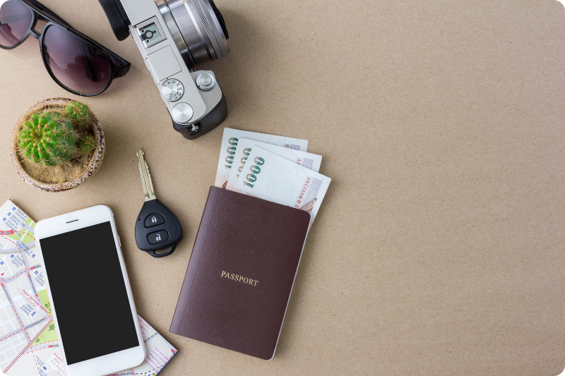 Travel essentials for solo travel in Italy – passport, cash, phone, camera and map ready for an Italian adventure.