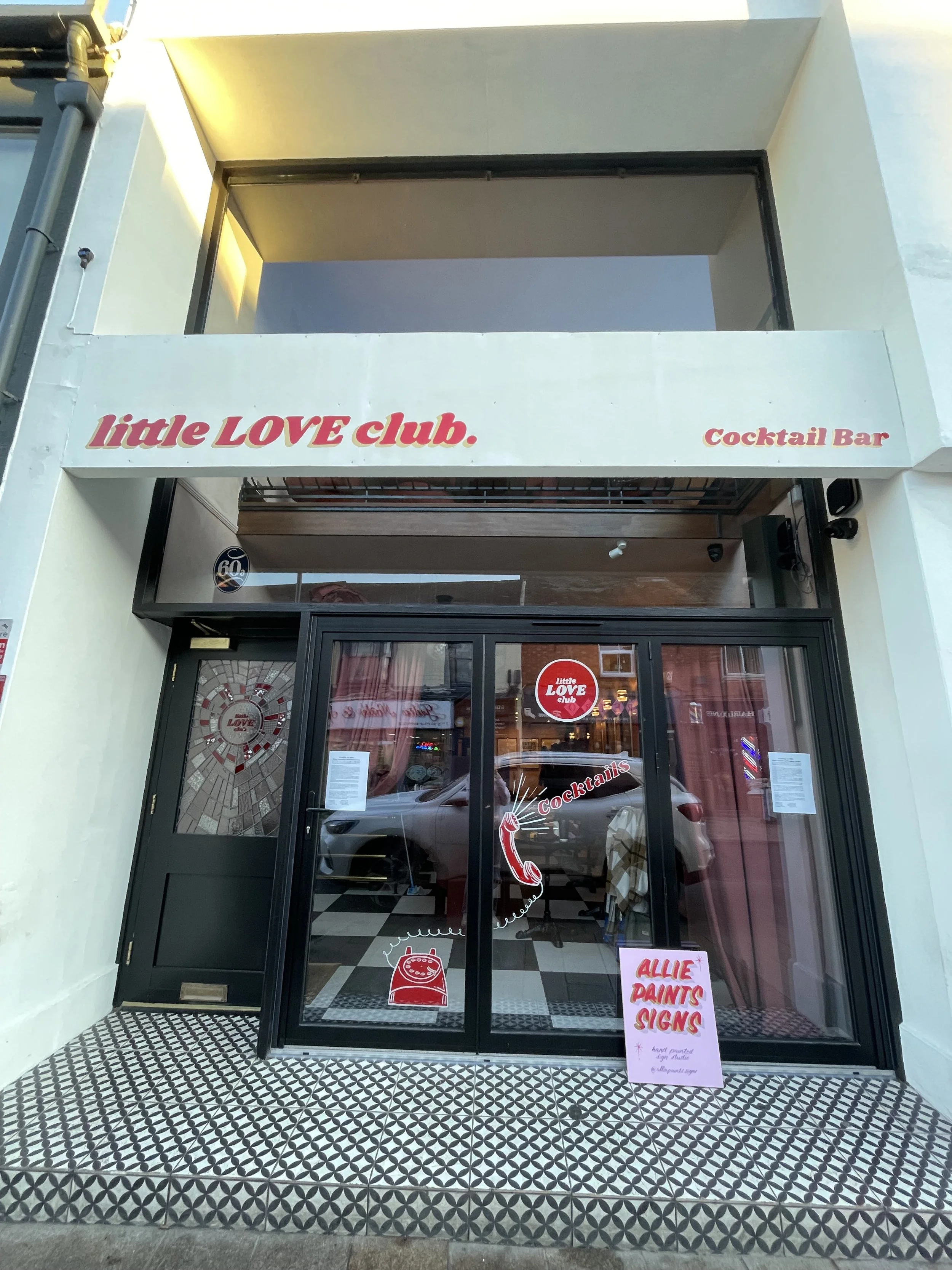 Cocktail bar Store front fascia sign writing and window