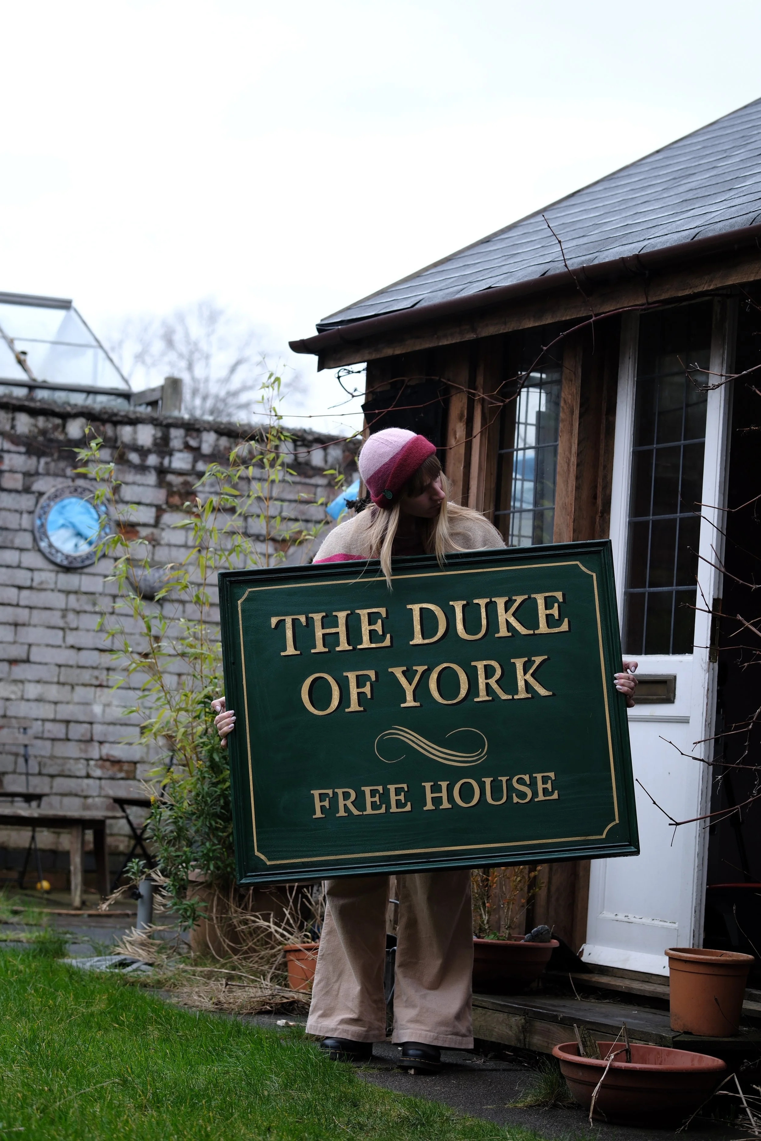 Allie holding the the sign used in a Tv show