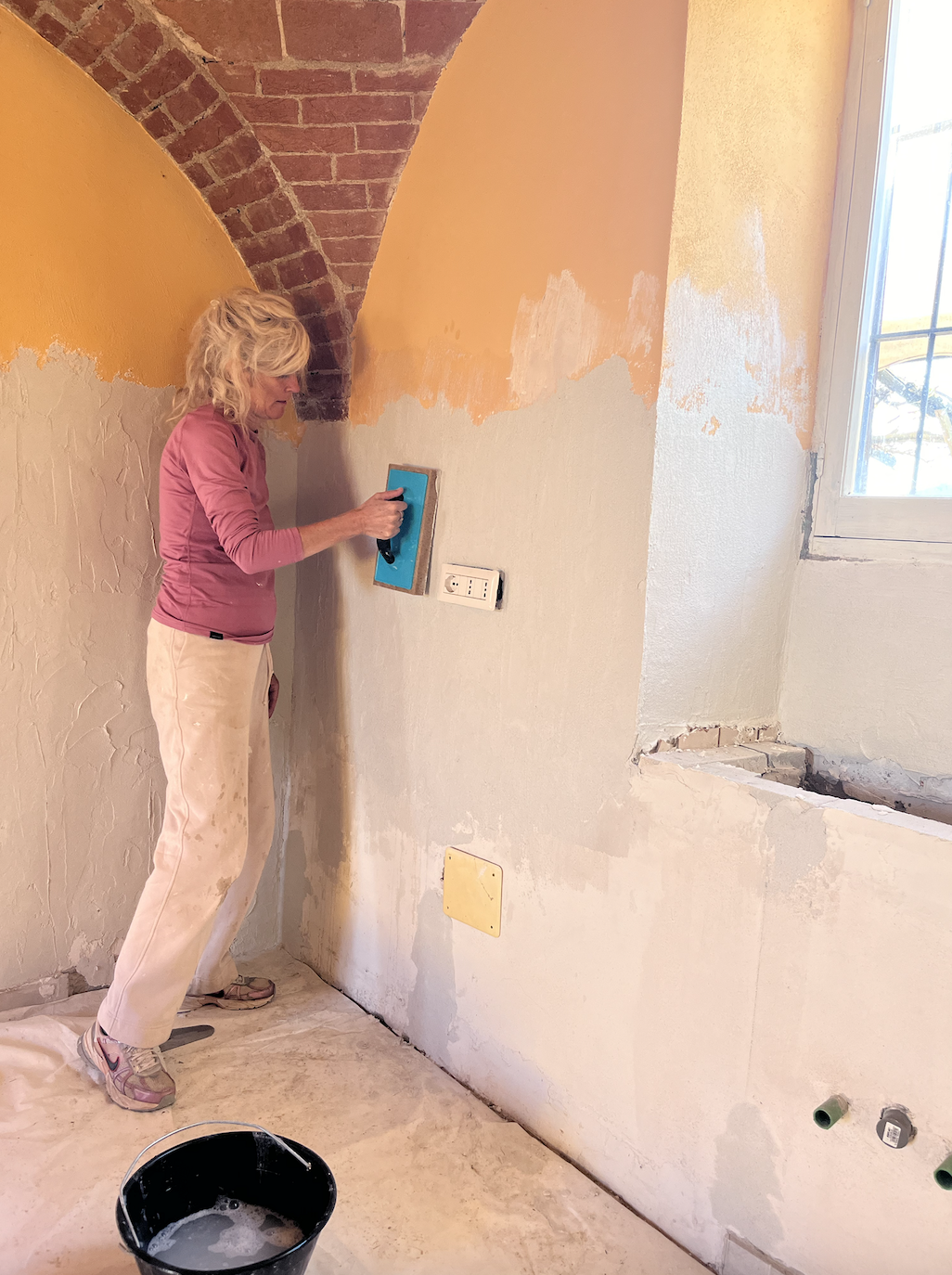 Woman building a conscious community in italy.png