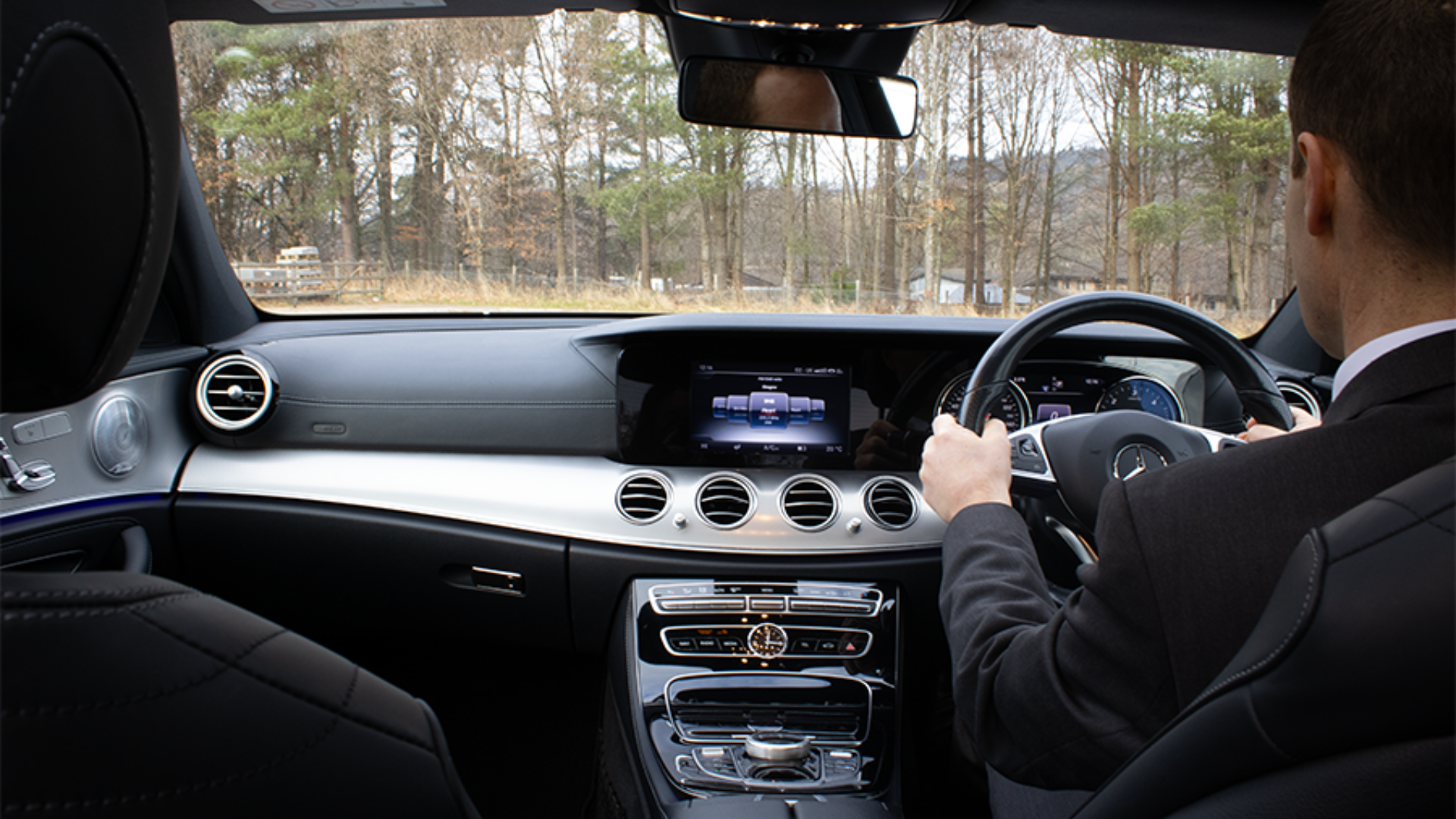Chauffeur driver in front of the wheel