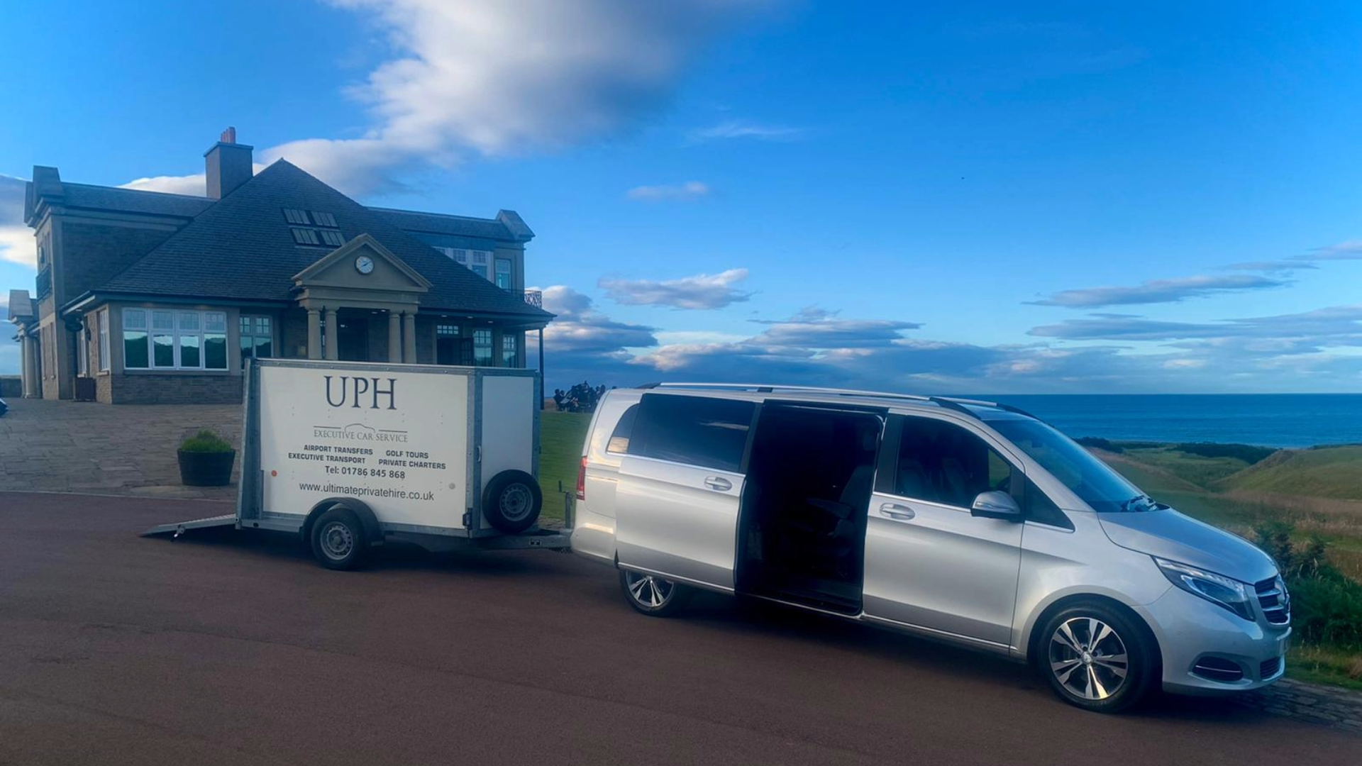 7-seater Mercedes-Benz V-Class with trailer sitting outside passenger's home