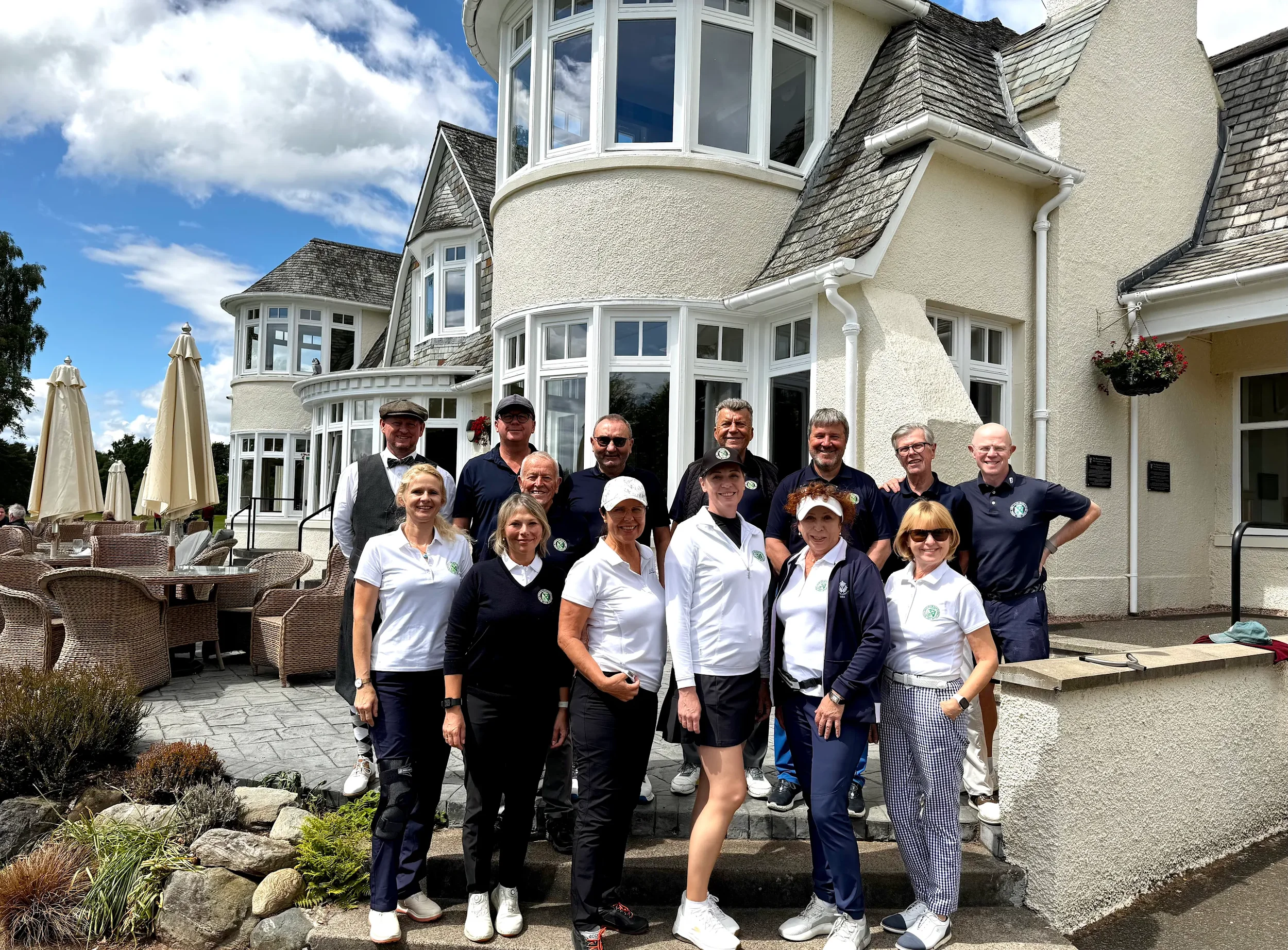 Group photo of international golf tour group in their golf gear ready to play golf in Scotland