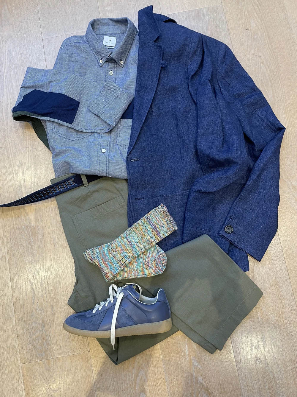 With casual blazer and trainers