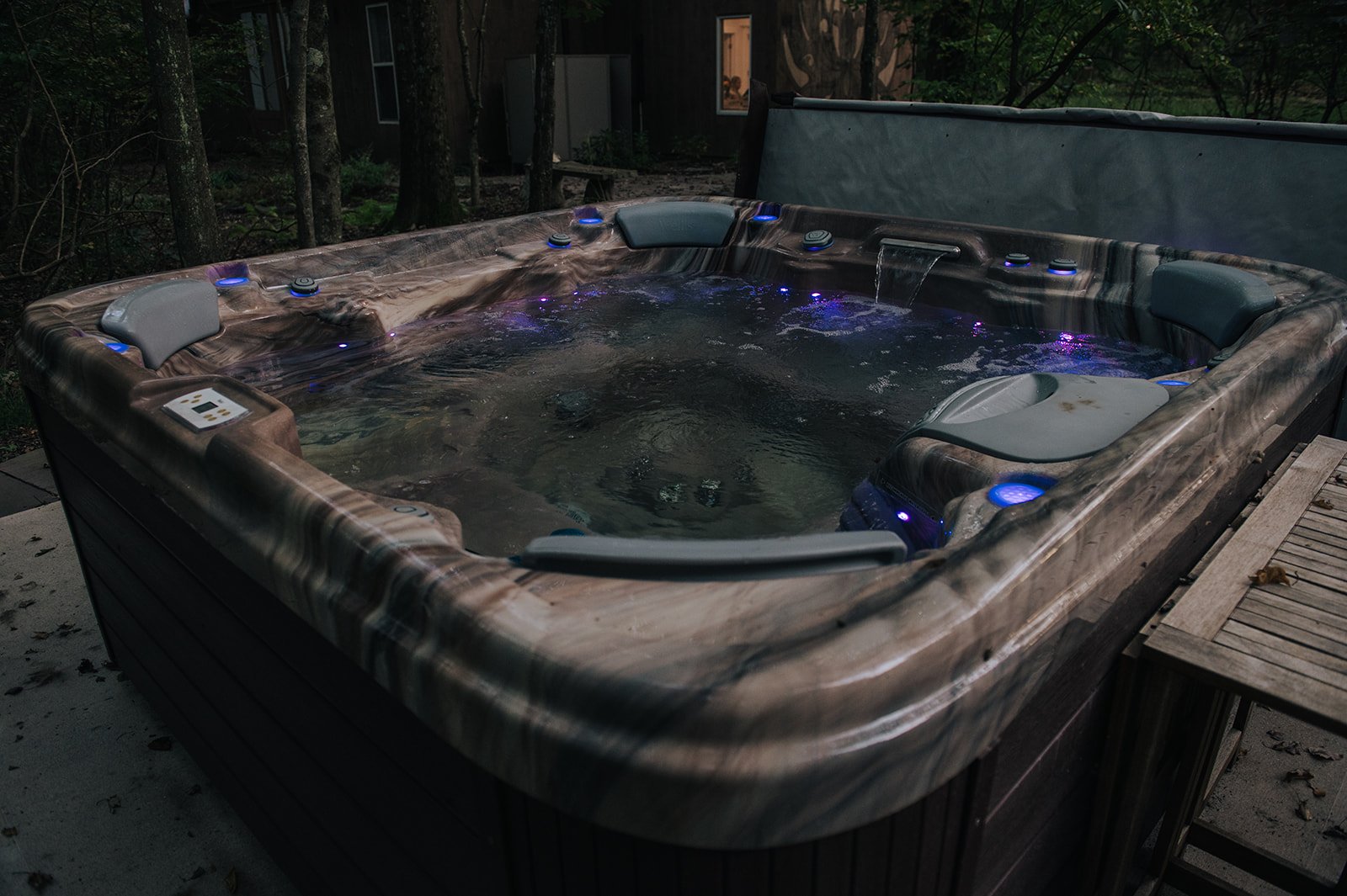 Luxurious outdoor hot tub comfortably seats 8, beach size cozyearth towels included in your room.