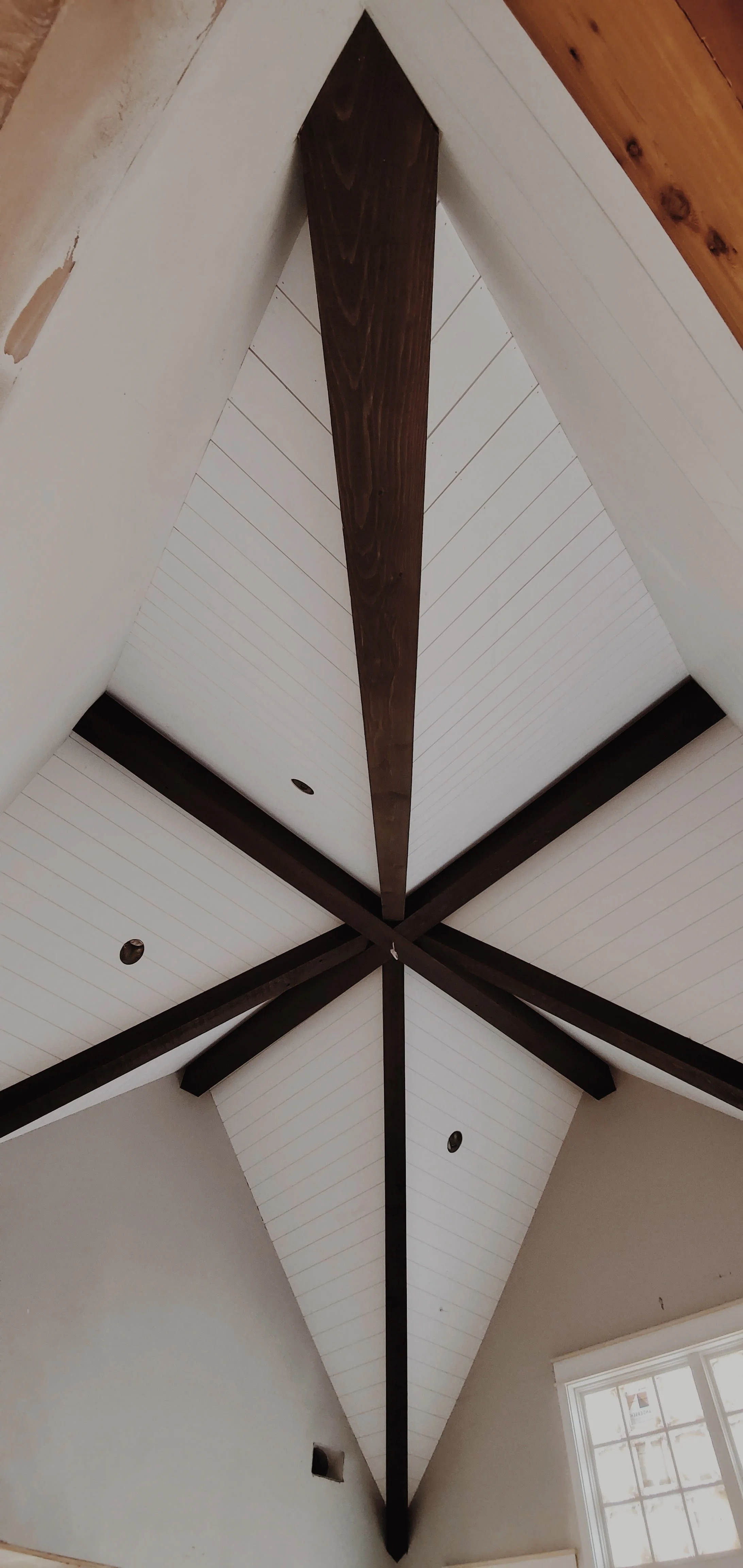 Custom wood beam ceiling with tongue and groove ceiling installation in Greenville SC