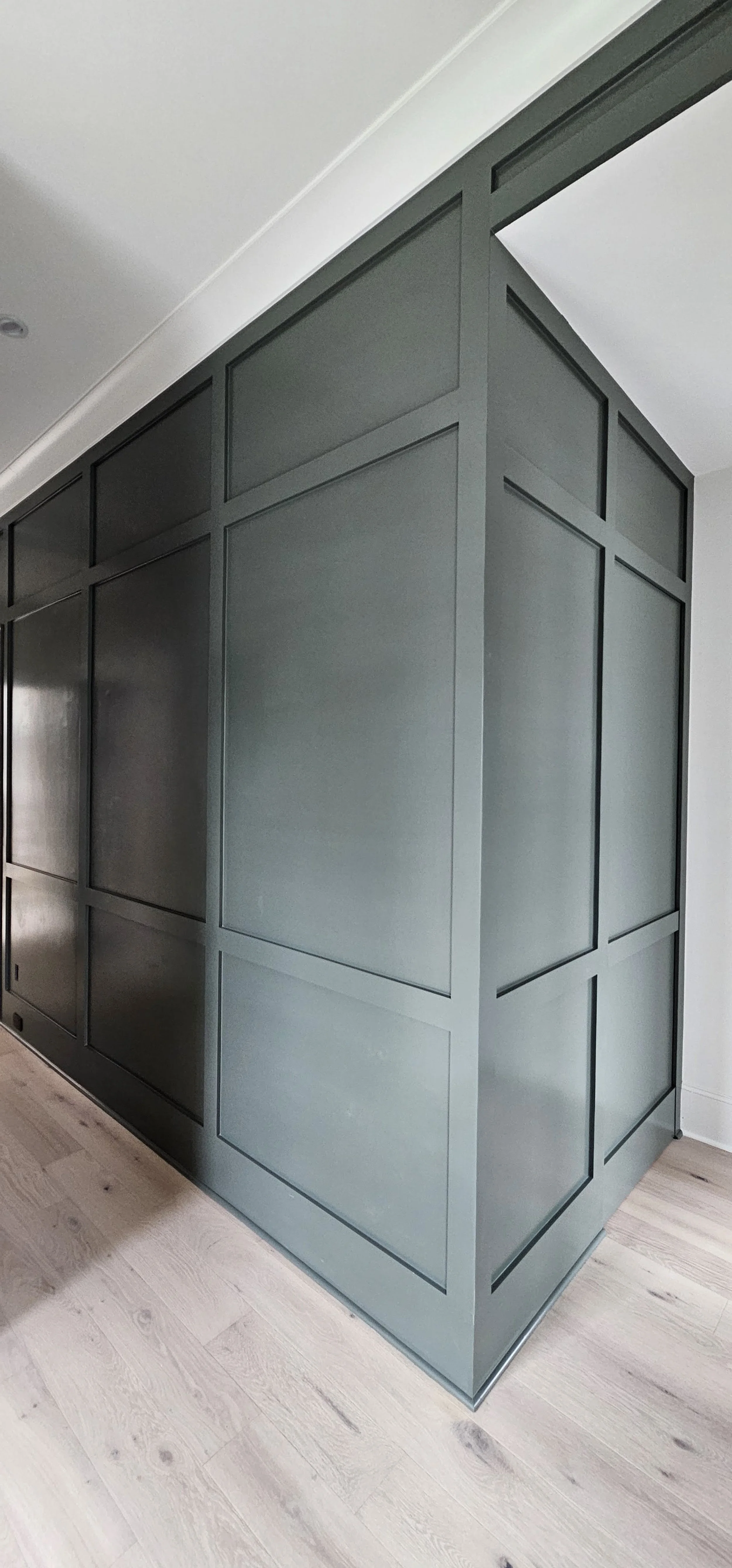 Custom wall paneling trim installation with modern design in Greenville SC