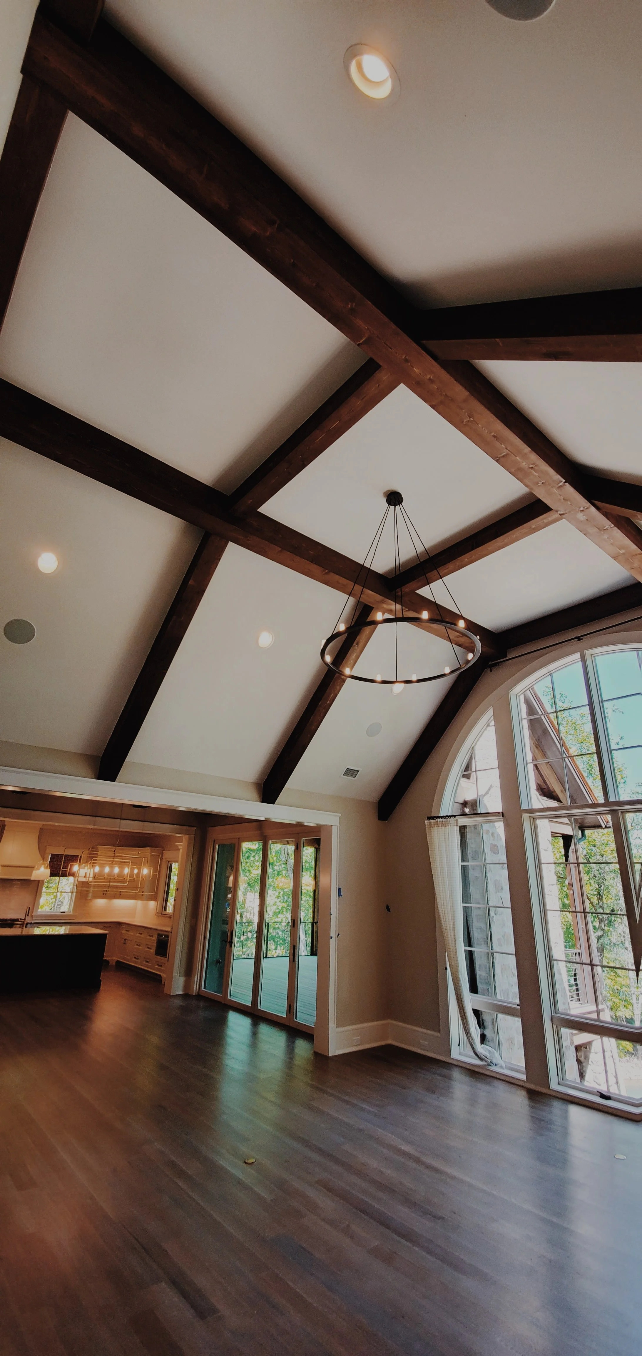 Custom vaulted ceiling with exposed wood beams and trim detail in Greenville SC