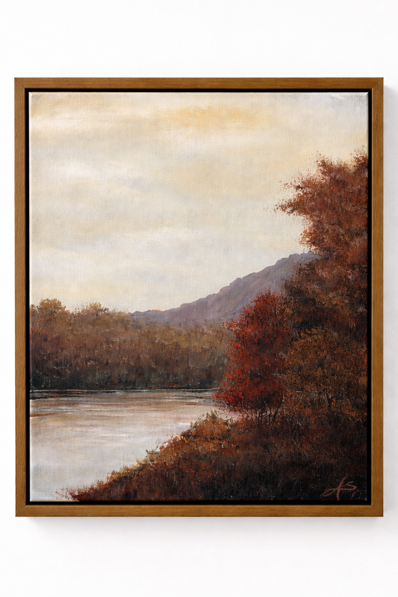 Painting of a landscape with a river, autumn trees with red and orange leaves, hills, and a cloudy sky.