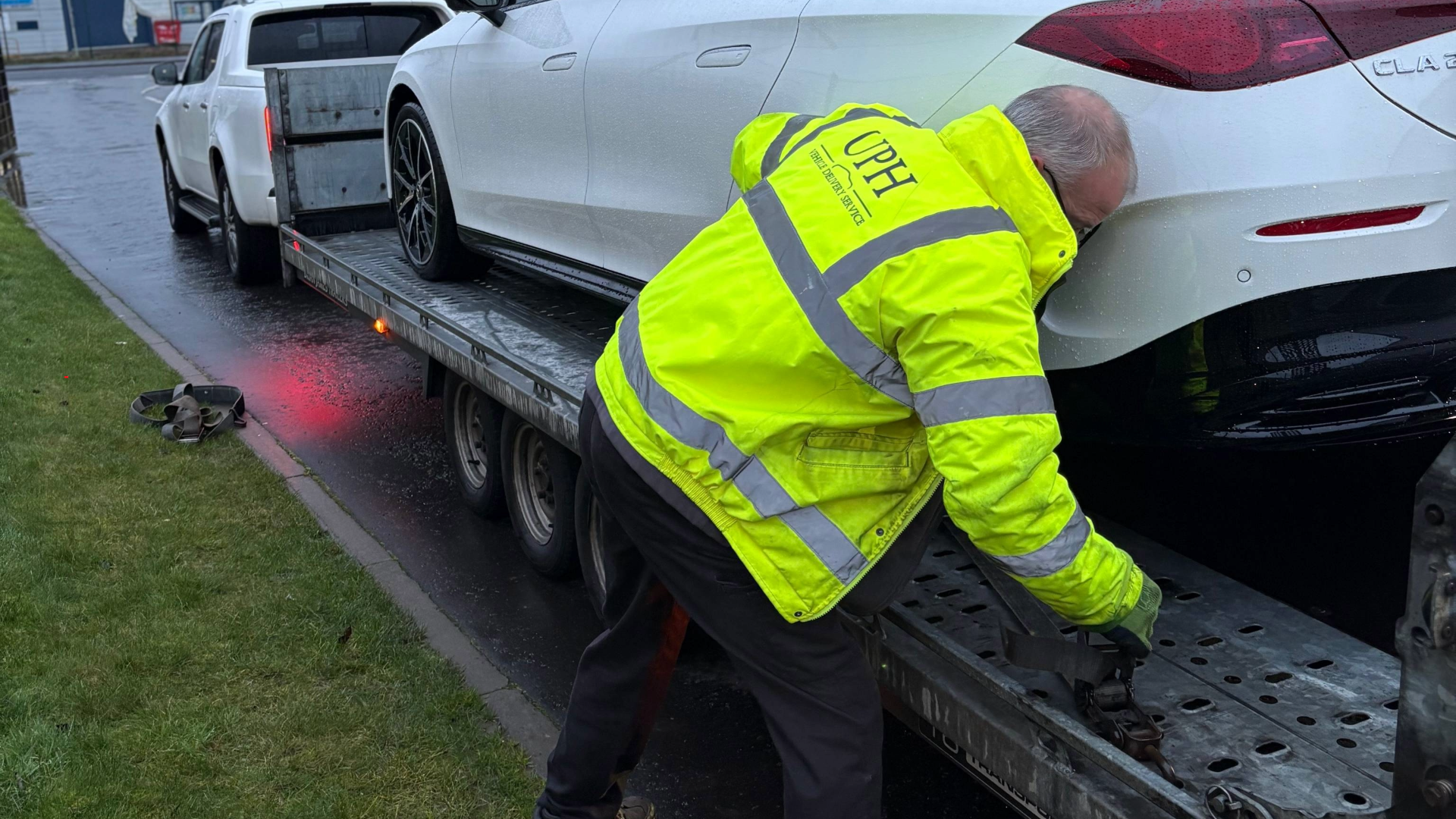 UPH VDS Team member strapping in vehicle for delivery
