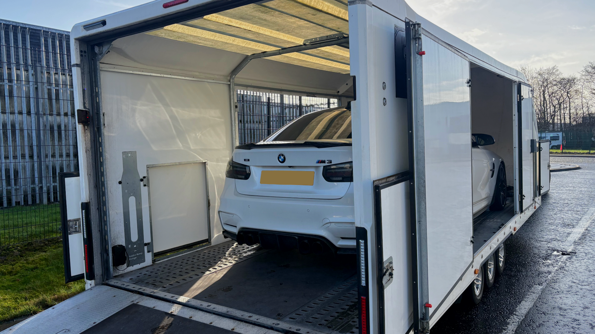 BMW on enclosed car transporter