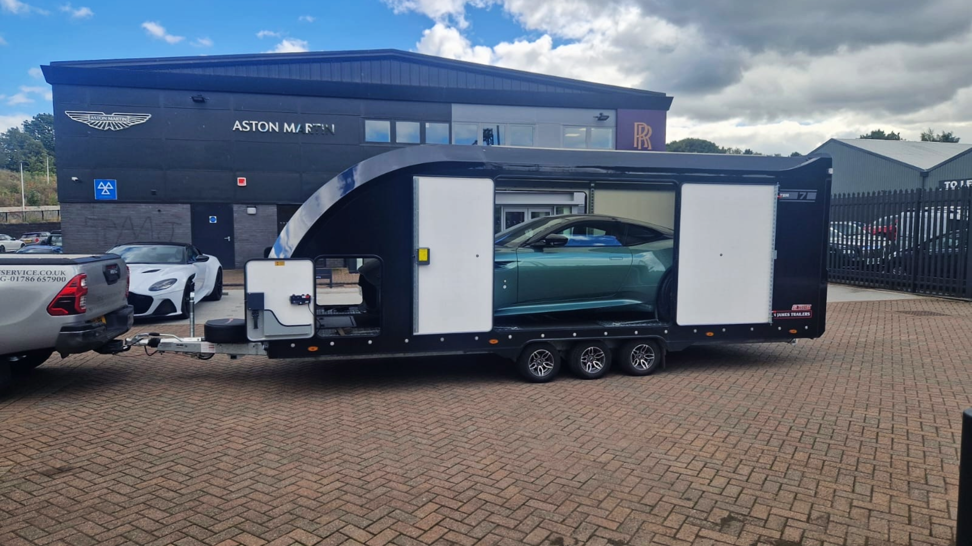Aston Martin in an enclosed trailer for transport