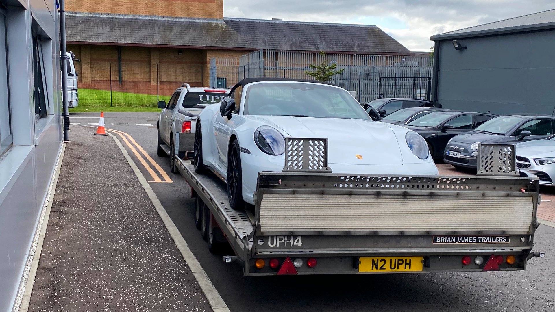 white luxury porsche on single vehicle trailer ready for delivery-2 - 2026-04-27T163622.492.png