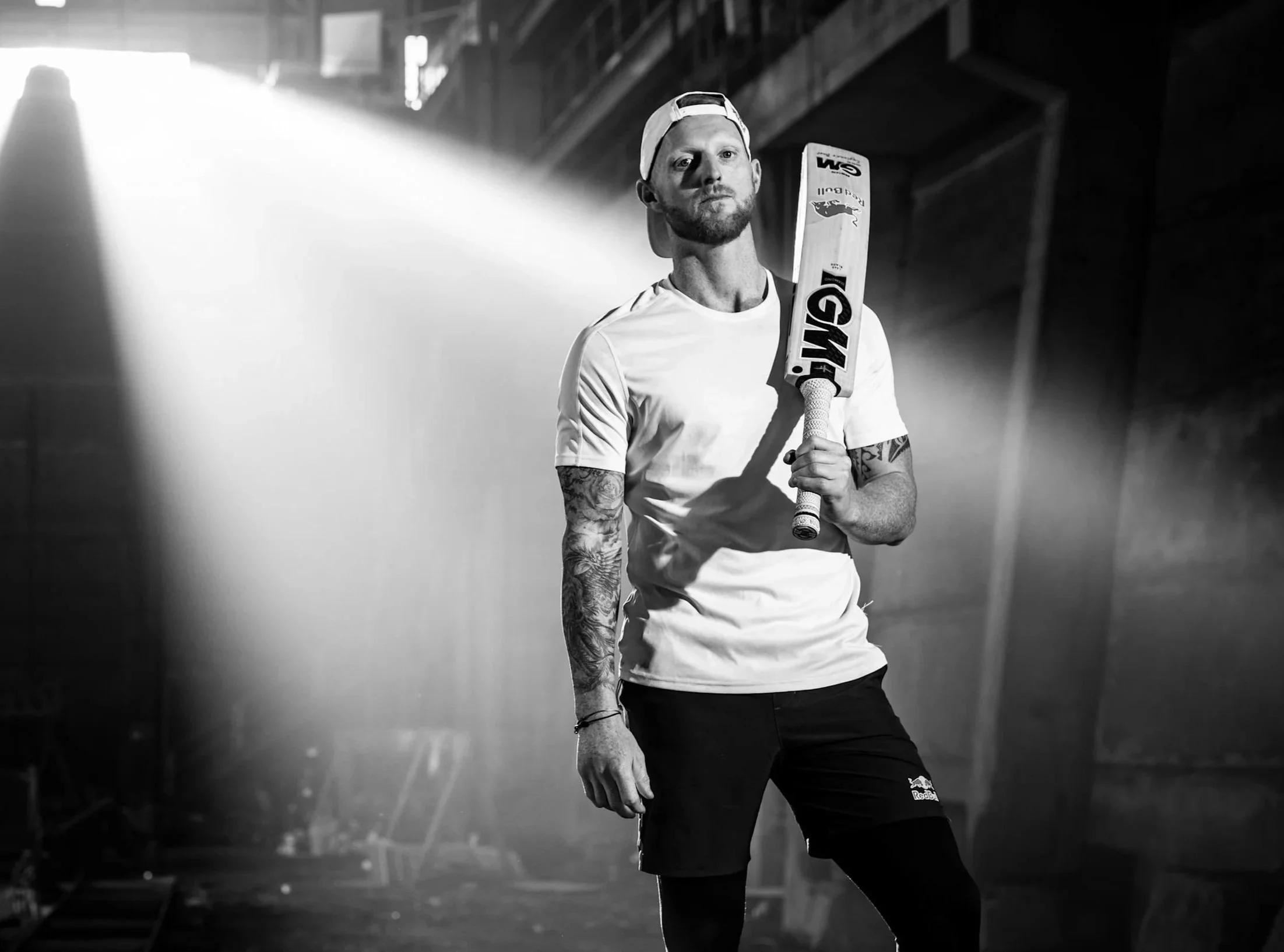 Ben Stokes holding his cricket bat during a photo shoot.