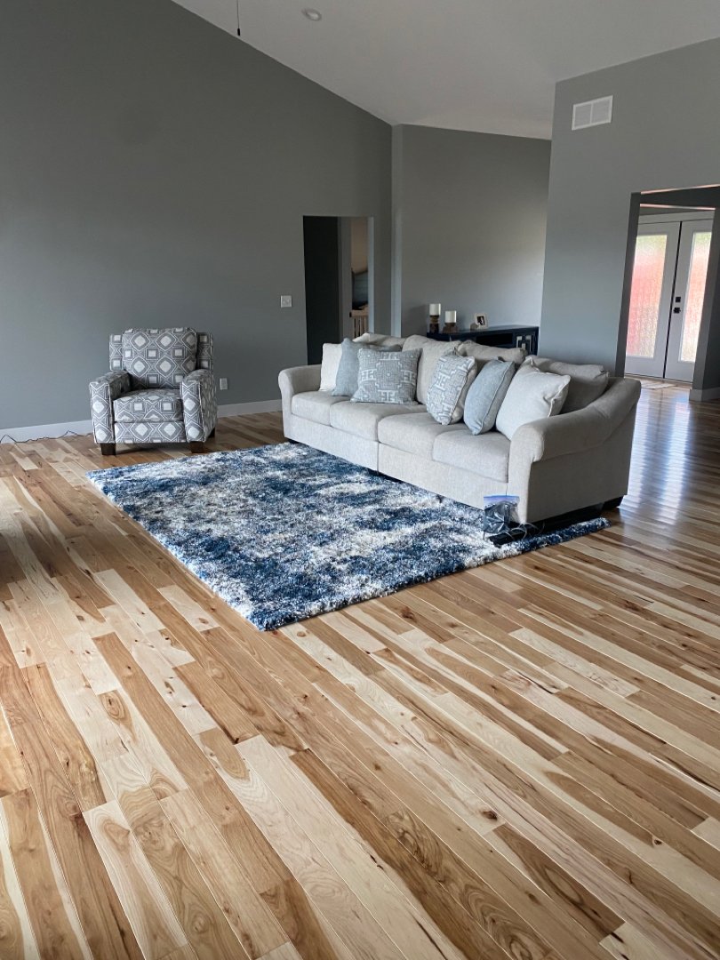 Hickory wood with a natural stain. Floor installation in a private residence.