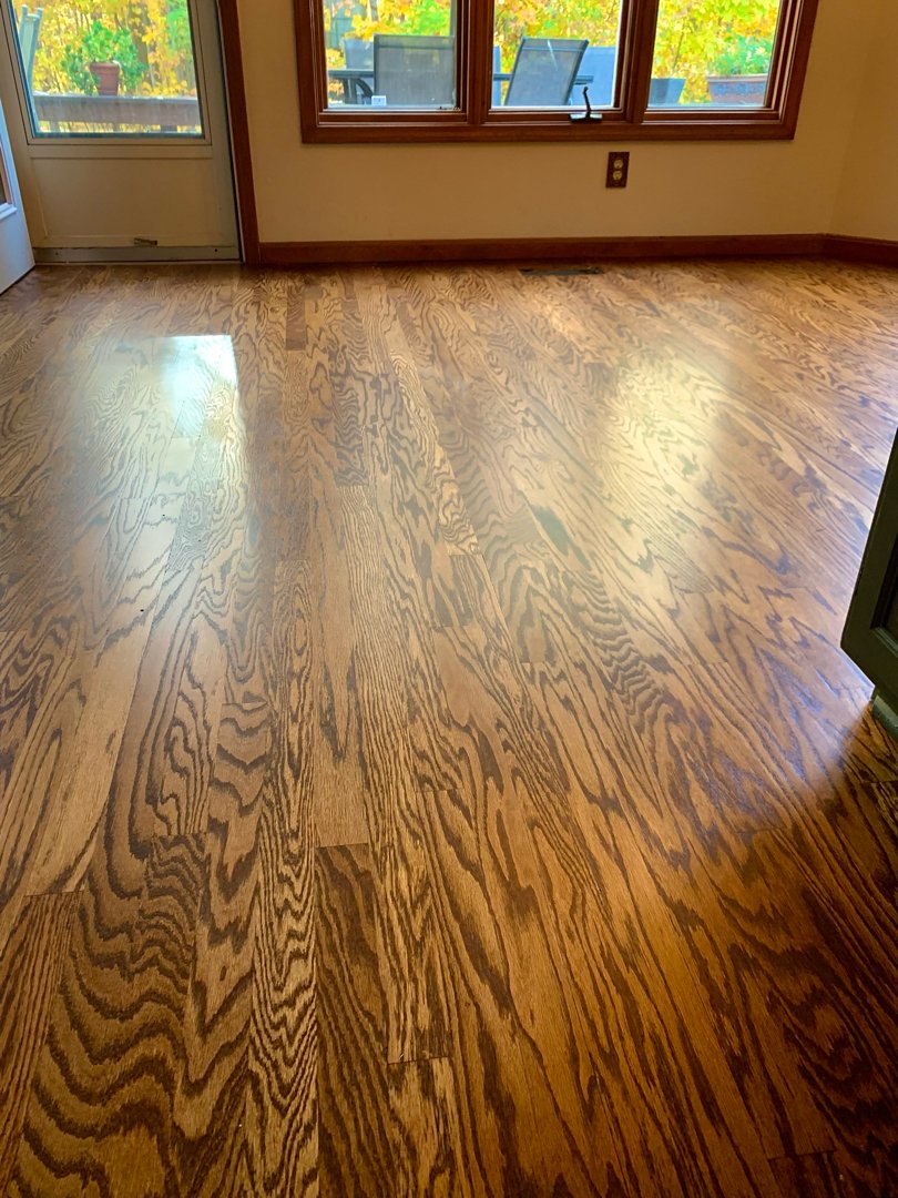 Red oak wood with a golden brown stain, floor restoration