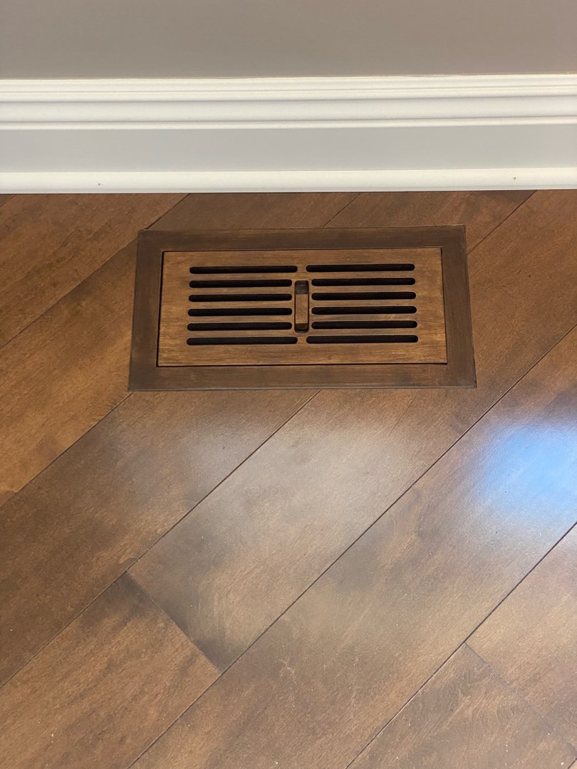 Floor installation in a private residence. Custom air vent.