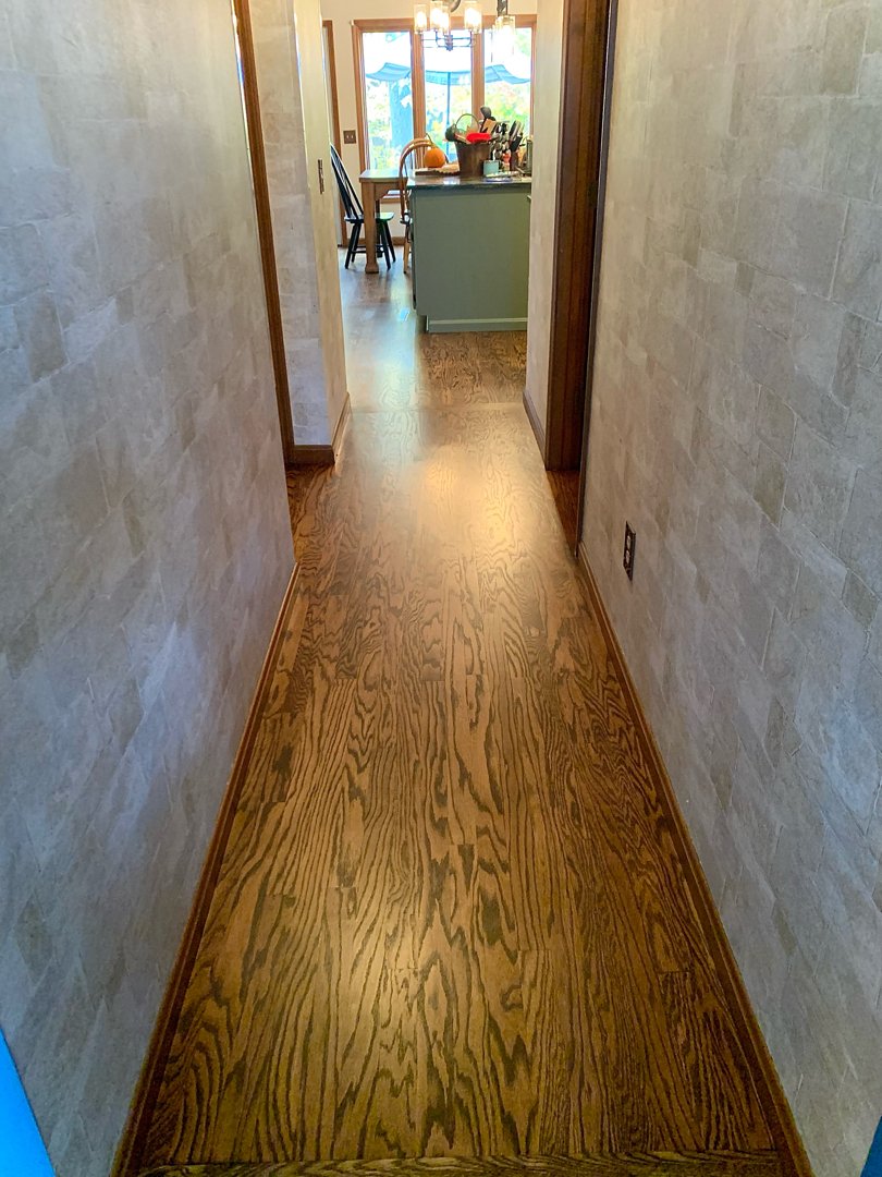 Red oak wood with a golden brown stain, floor restoration