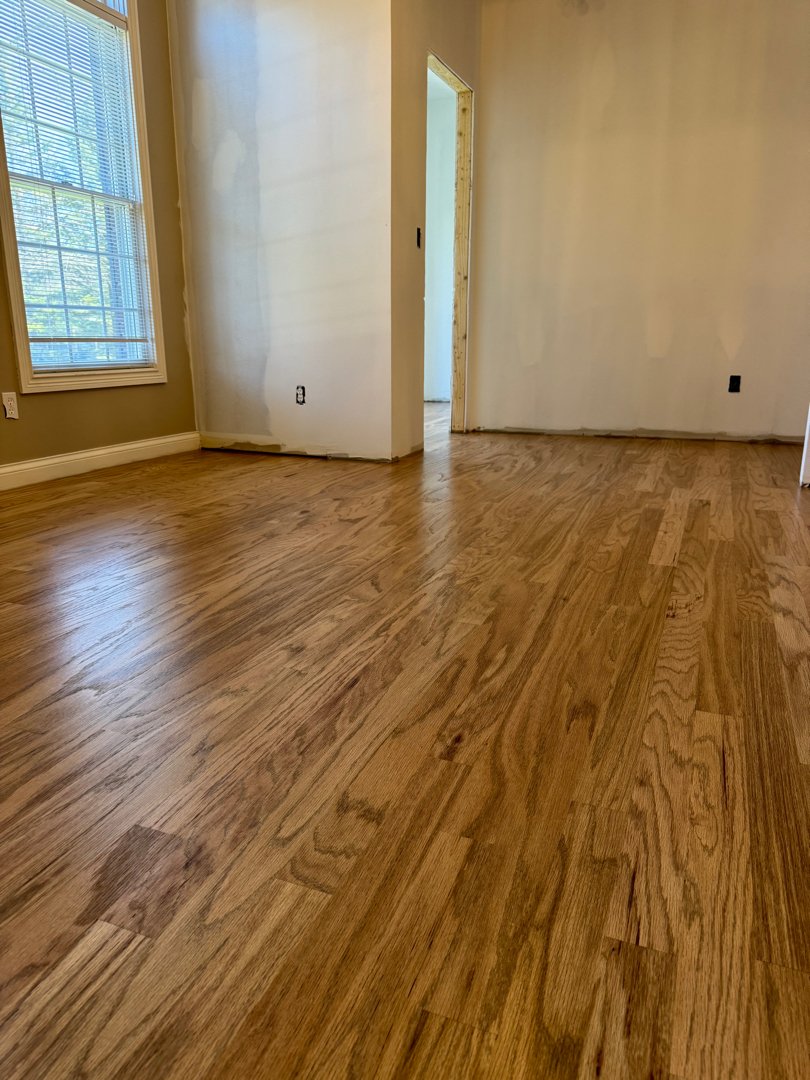 Red oak wood with a duraseal weathered oak stain. Floor installation in a private residence.