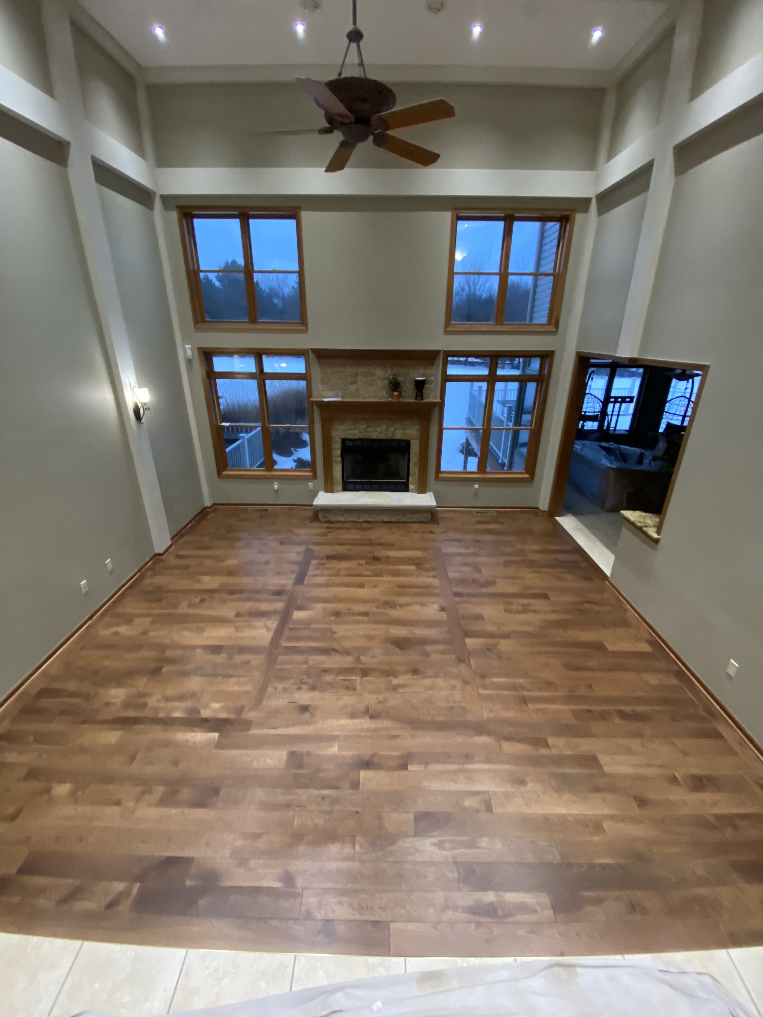 Hickory wood with a nuthatch stain. Floor installation in a private residence.