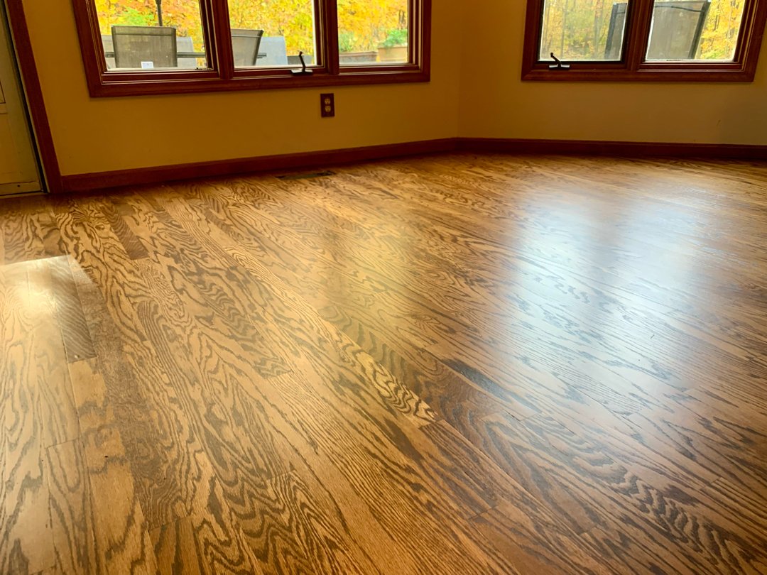 Red oak wood with a golden brown stain, floor restoration