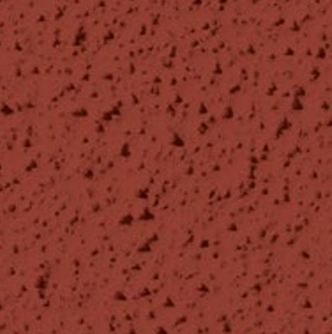 Surface rouge avec des taches noires