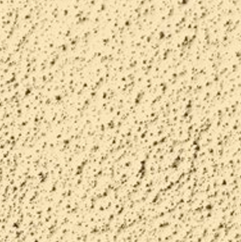 Surface texturée en béton beige avec des petits points noirs