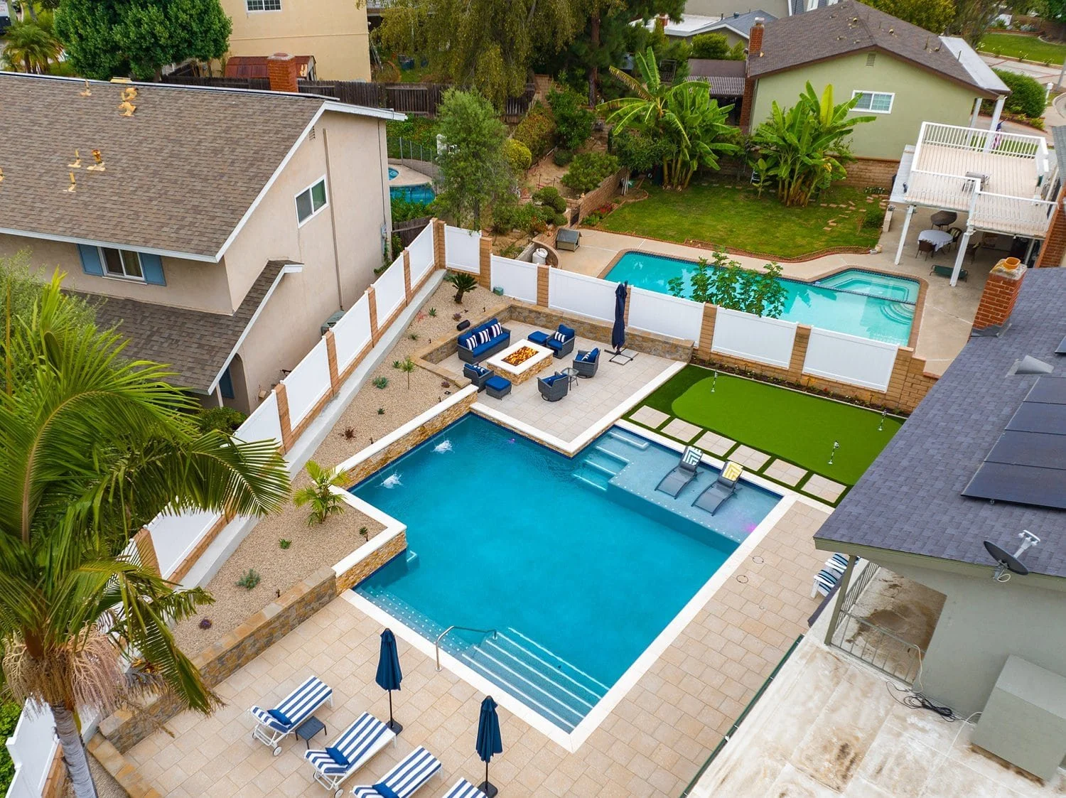 fullerton drone view of backyard with pool and putting green.jpg
