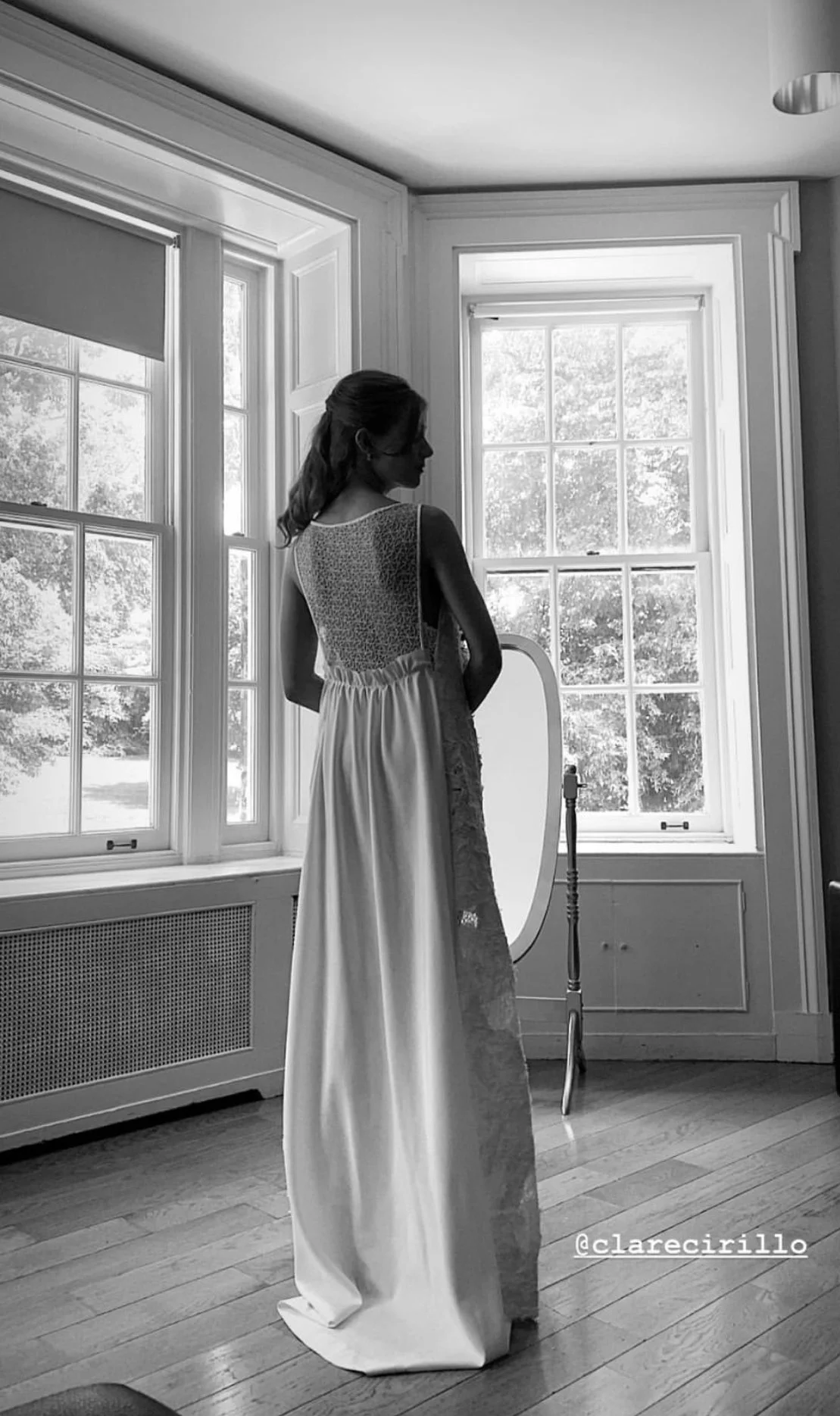 Geometric drawing of an outline square with sections divided by vertical, horizontal, and half circle lines.