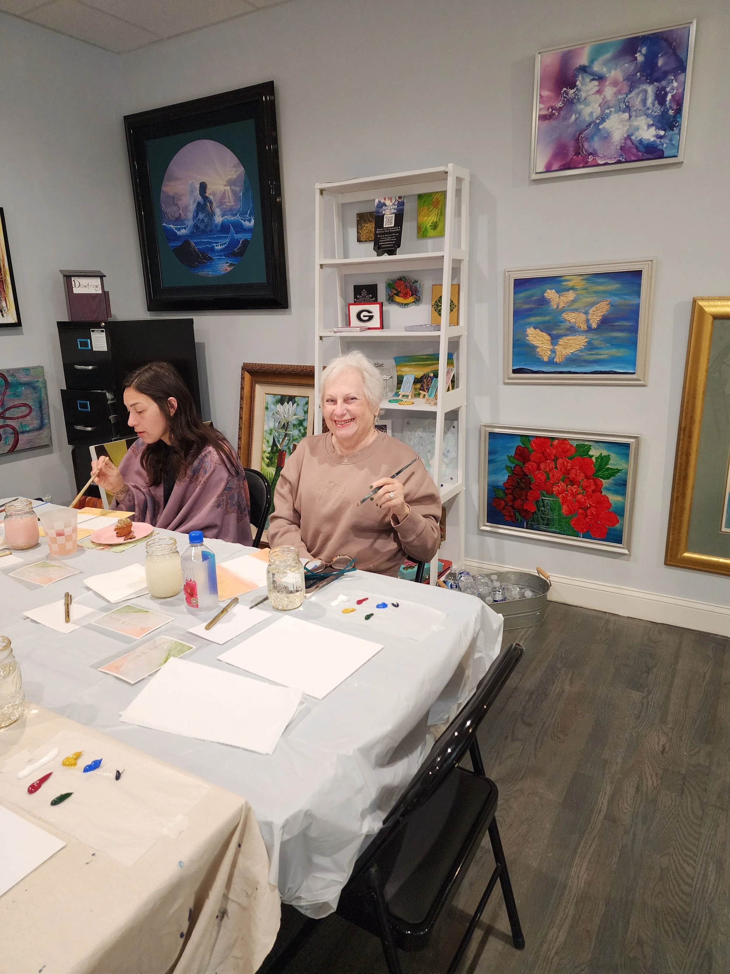 blooms-by-jesus-woman-smiling-painting-workshop.jpg