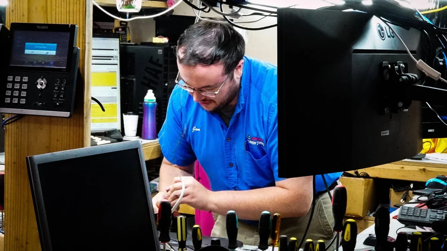 Technician at the repair bench in the Computer Tamers shop in Boone, NC